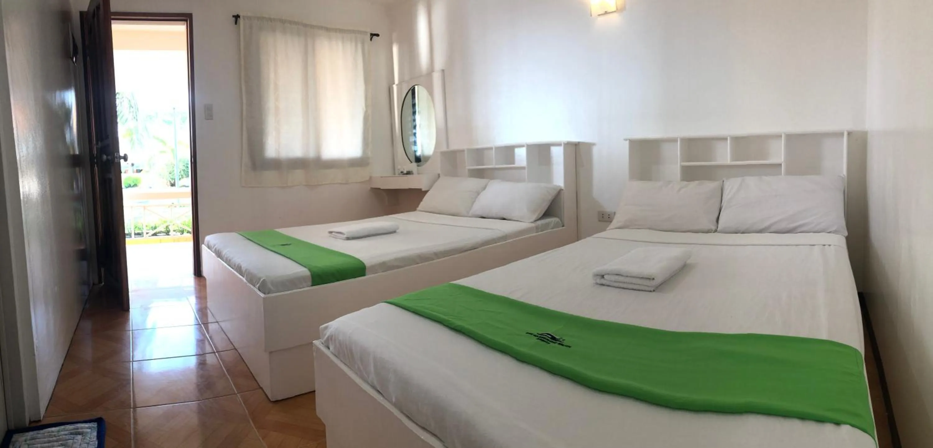 Bed in The Waterfront Beach Resort