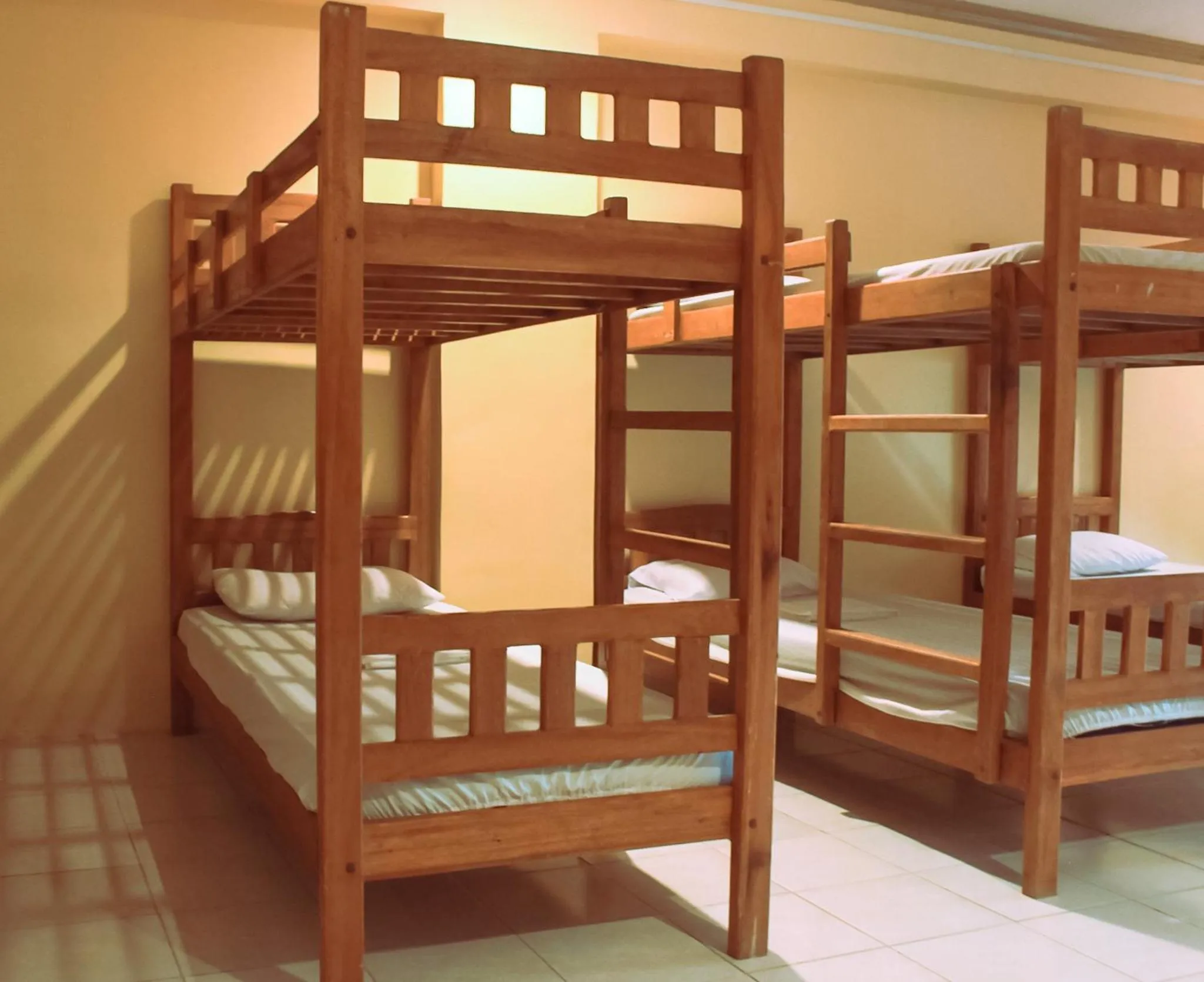 Bed in The Waterfront Beach Resort