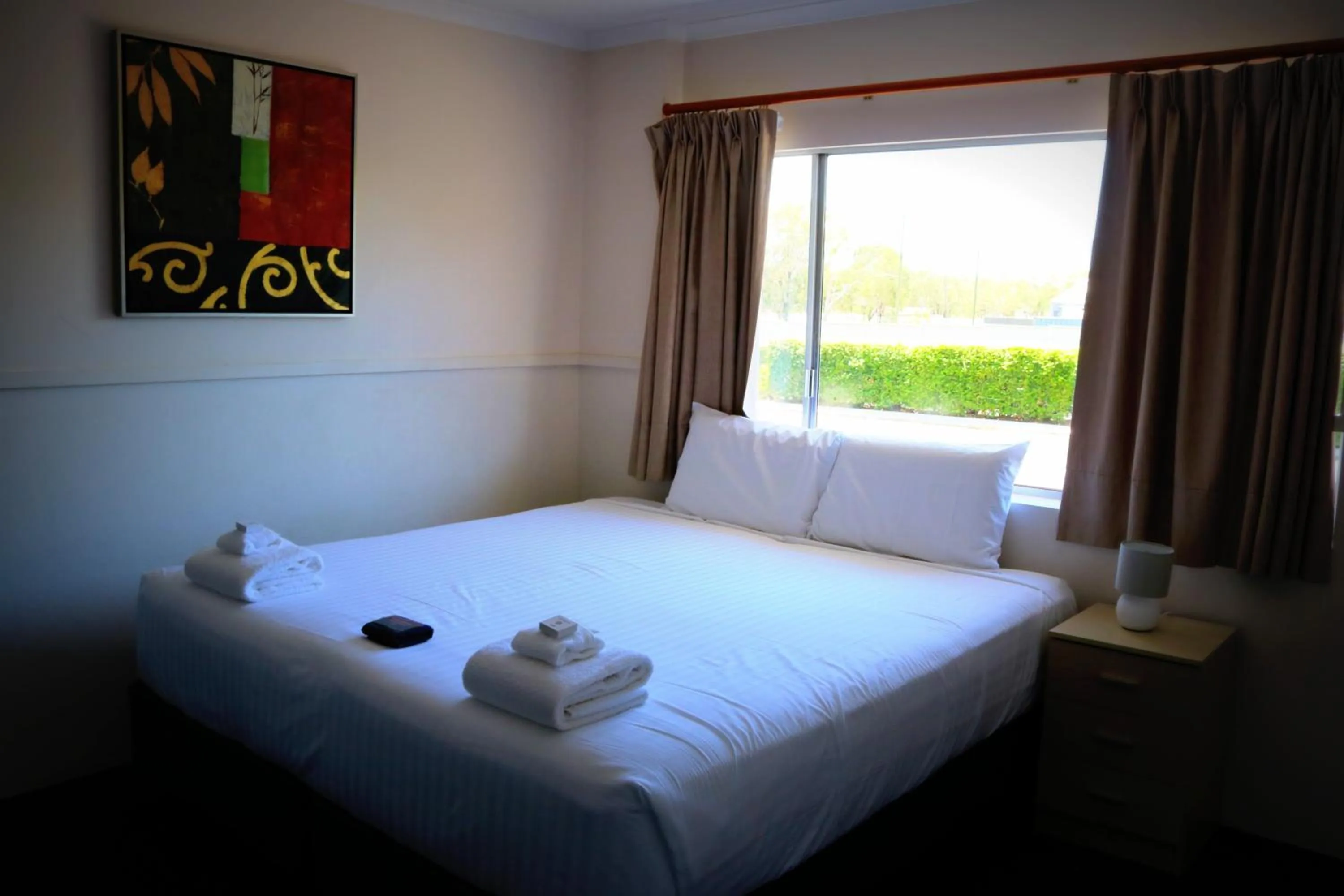 Bed in The Commercial Hotel Motel