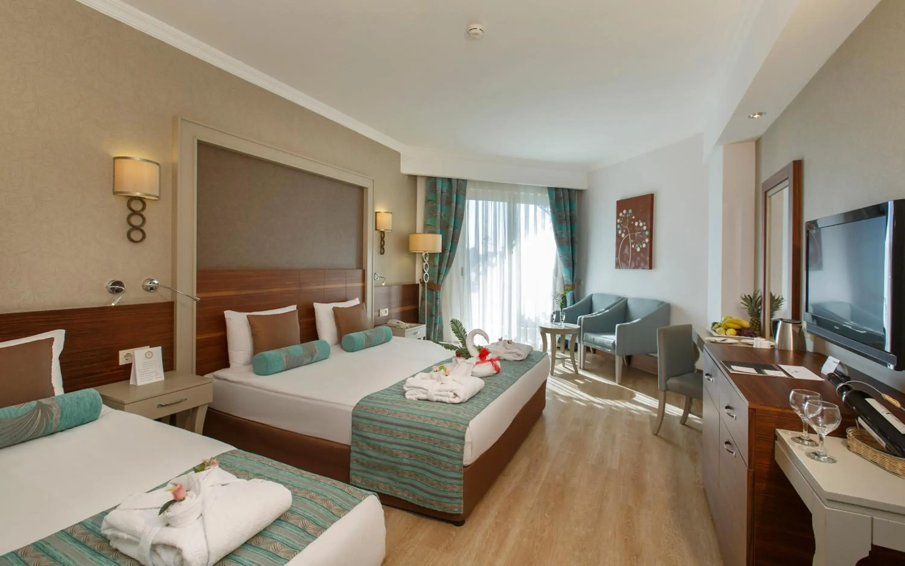 Communal lounge/ TV room, Bed in Side Crown Palace Ultra All Inclusive Communal lounge/ TV room, Bed in Side Crown Palace Ultra All Inclusive