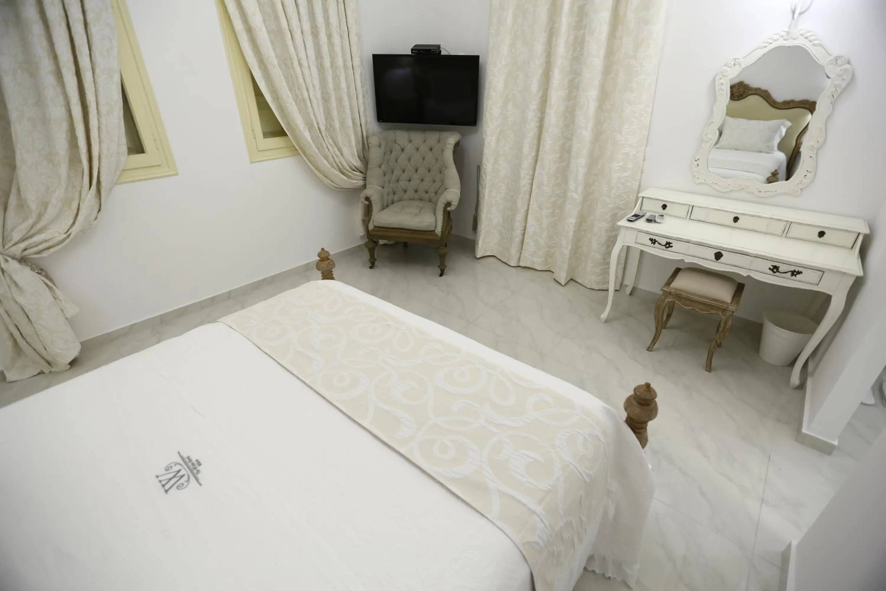 Photo of the whole room, Bed in The White Suites