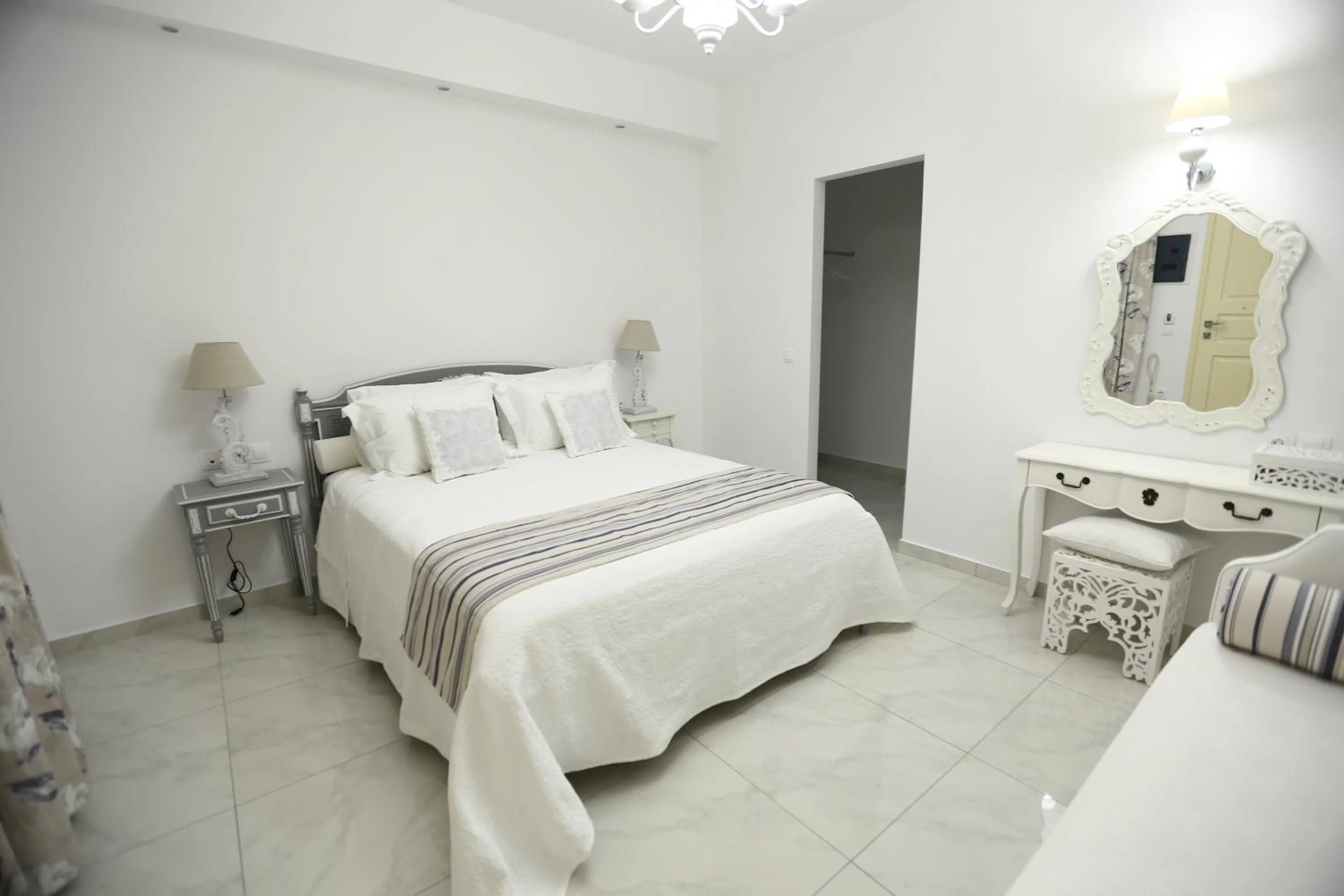 Photo of the whole room, Bed in The White Suites