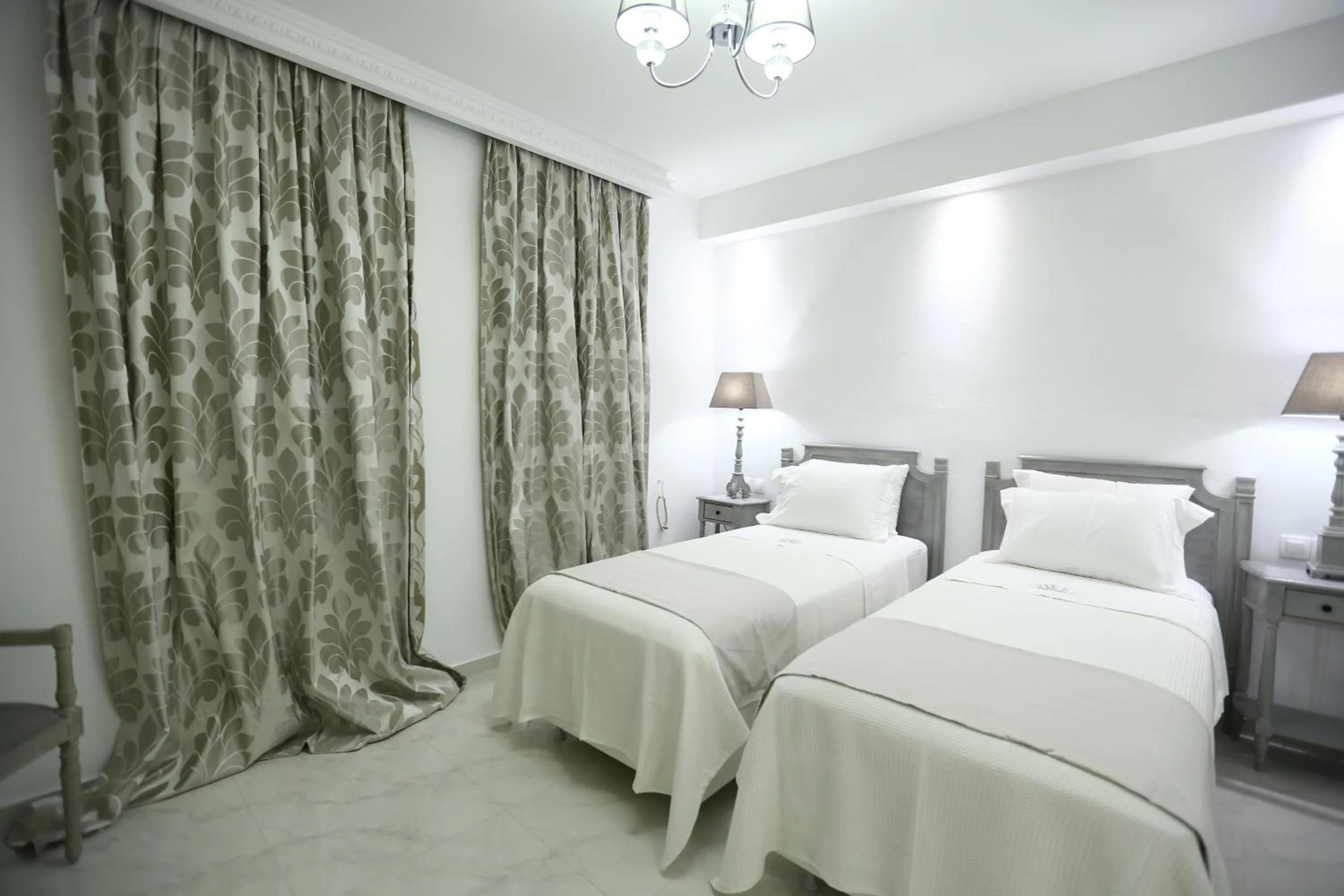 Photo of the whole room, Bed in The White Suites