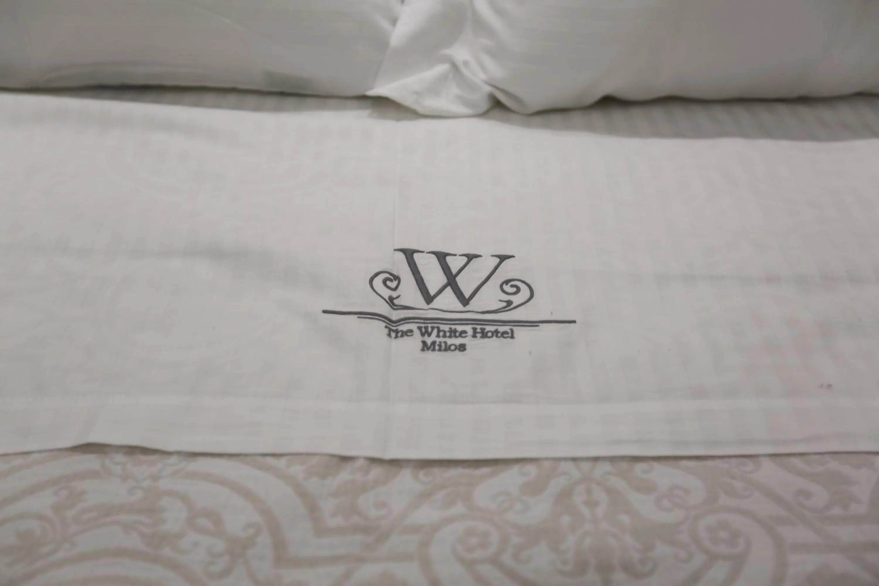 Property logo or sign, Bed in The White Suites