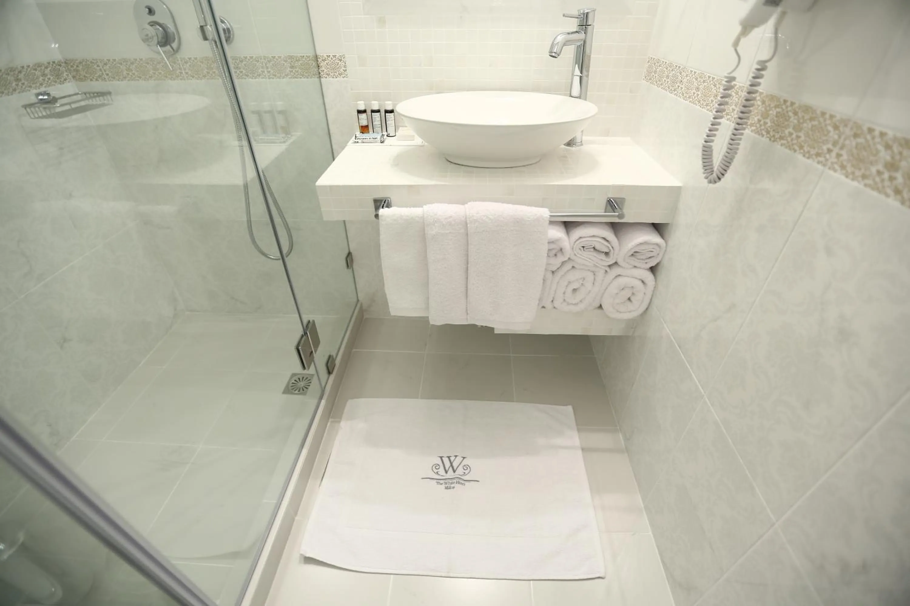 Property logo or sign in The White Suites