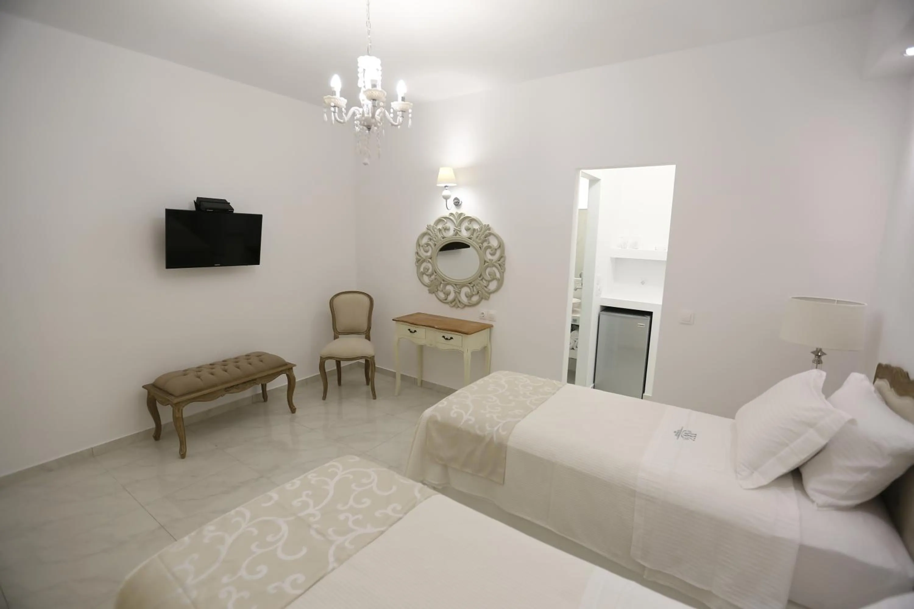 Photo of the whole room, Bed in The White Suites