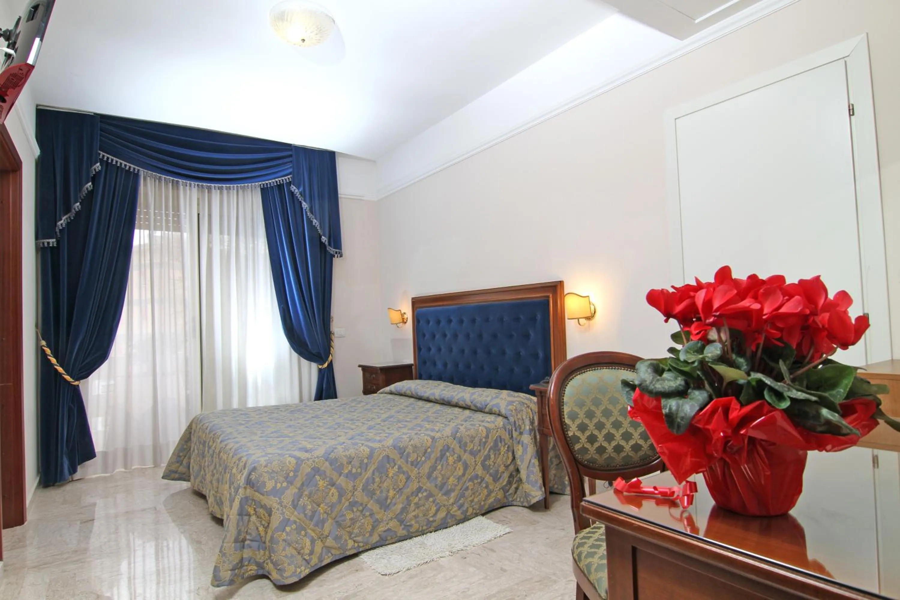 Bedroom in Mondial Park Hotel