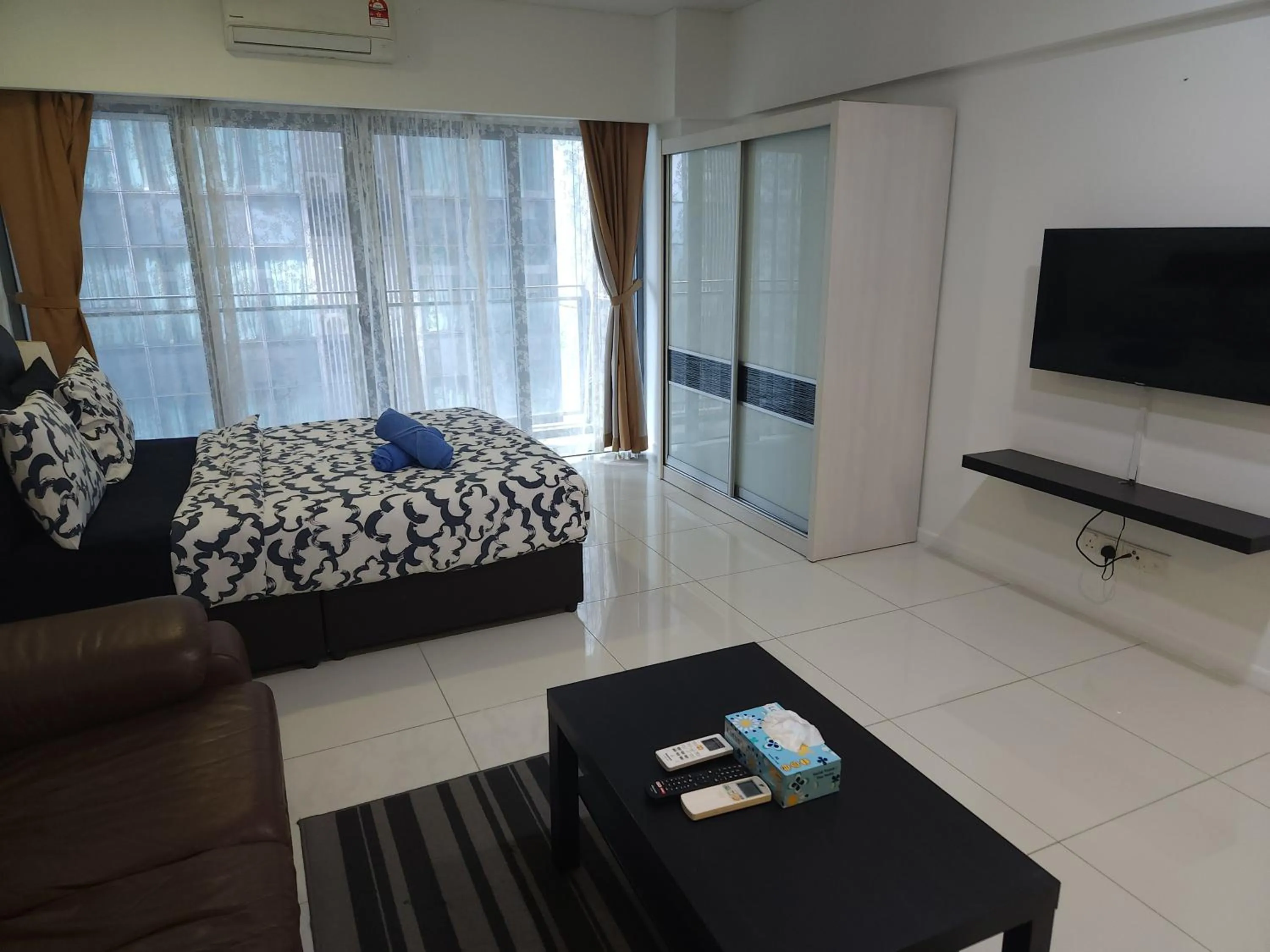 Bed in Summer Suites Studios