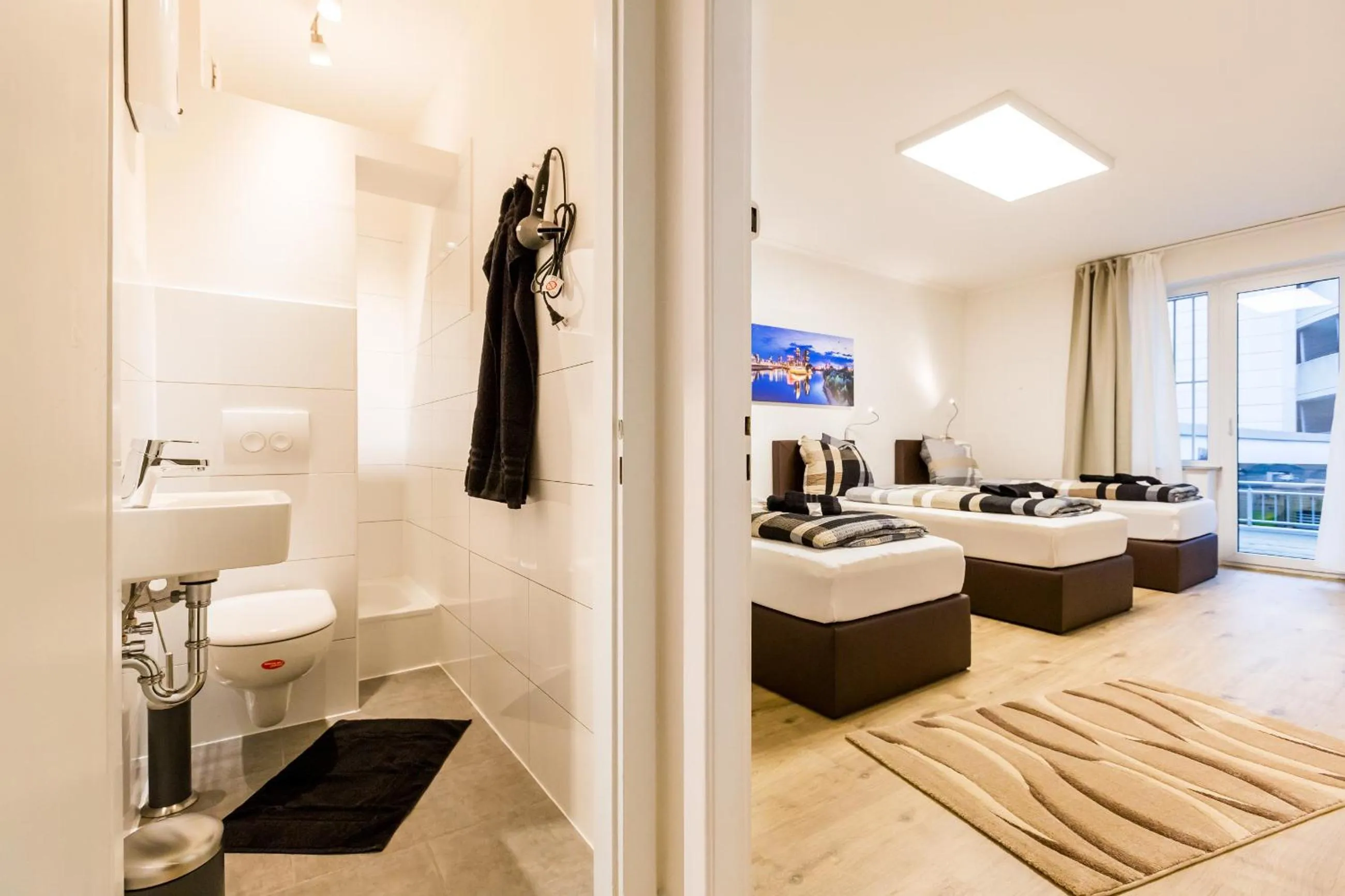 Bathroom, Bed in Centerapartments Tonhallenstraße