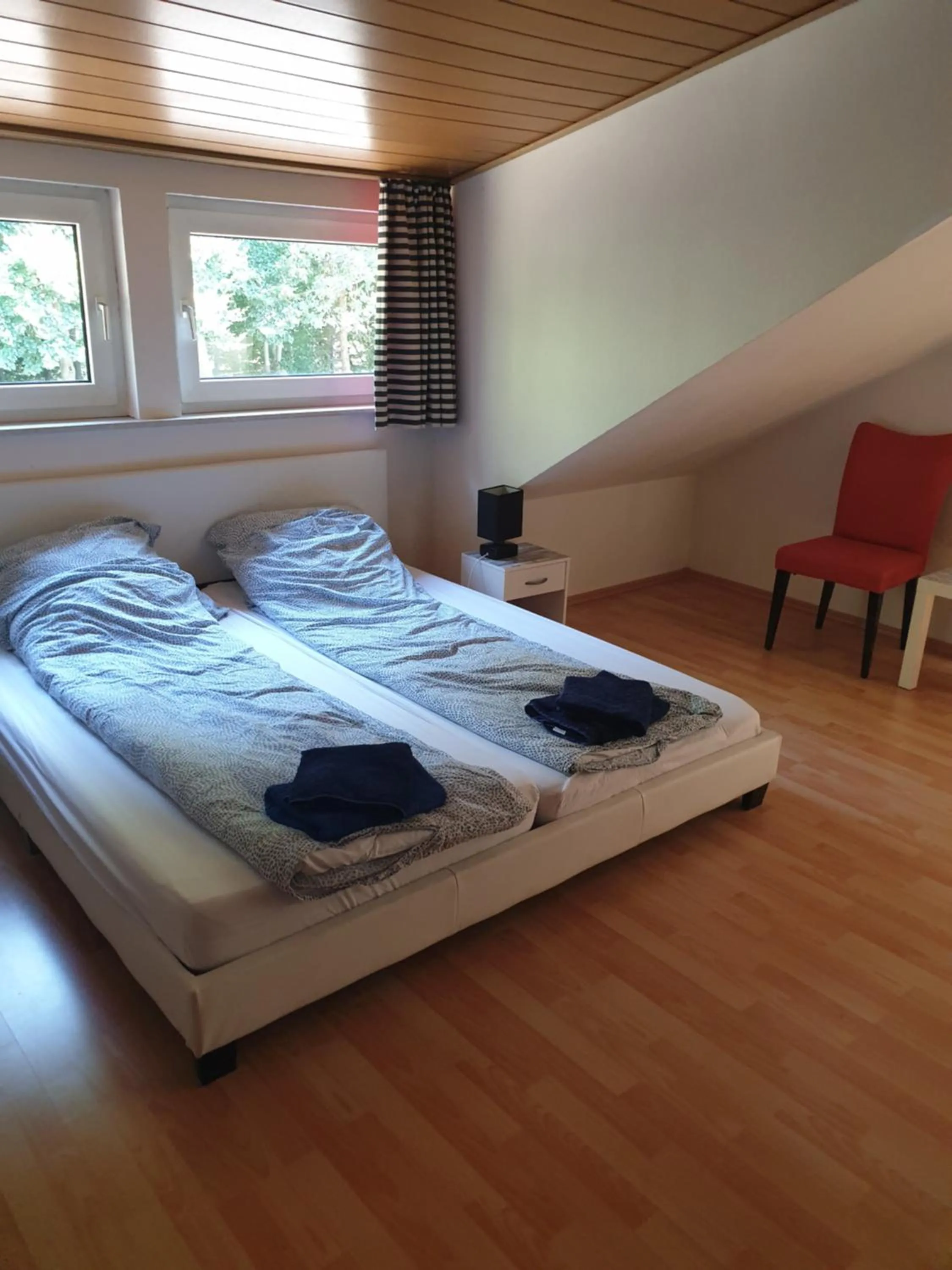 Bed in Famile Hotel Kameleon