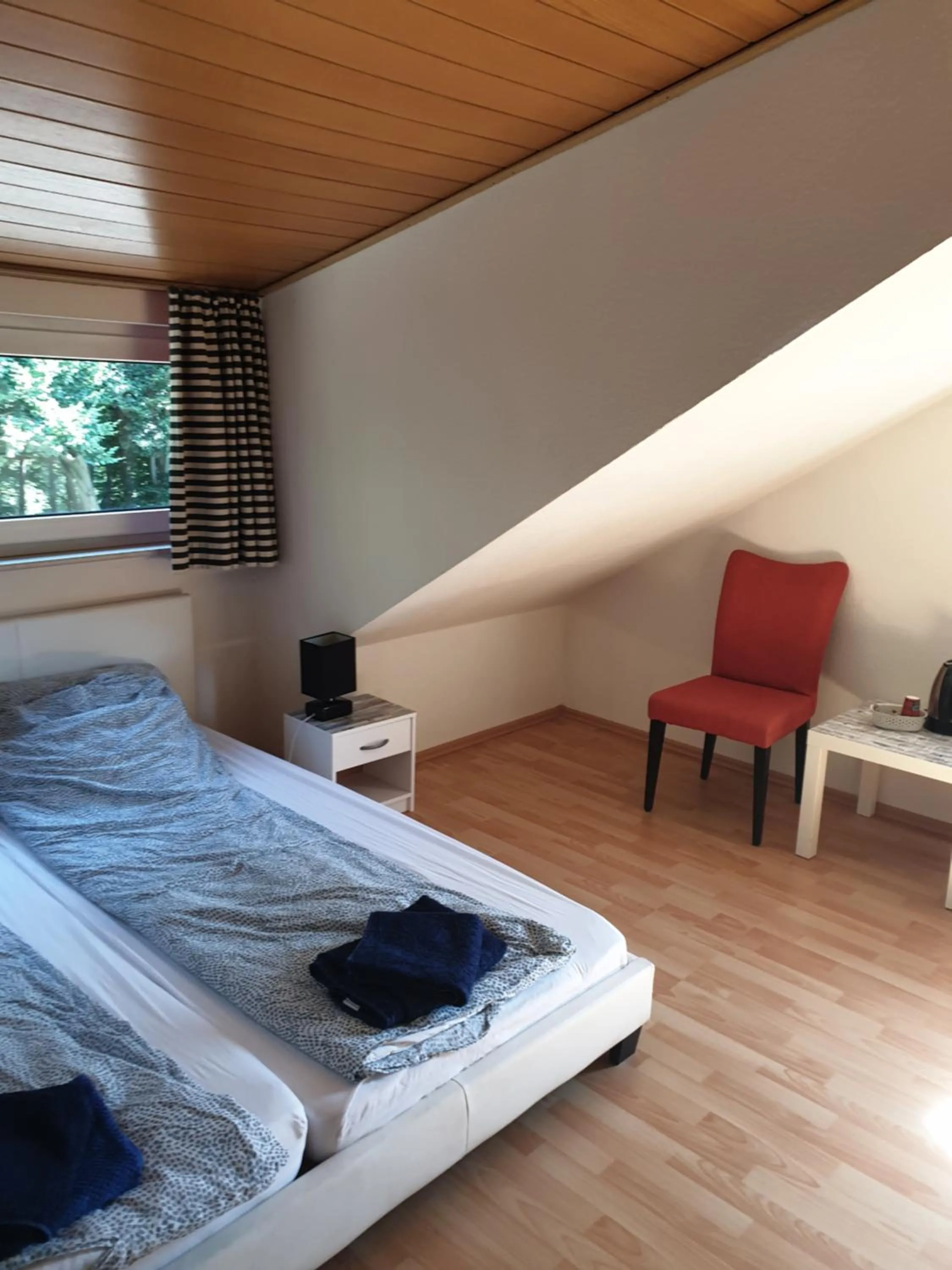 Bed in Famile Hotel Kameleon
