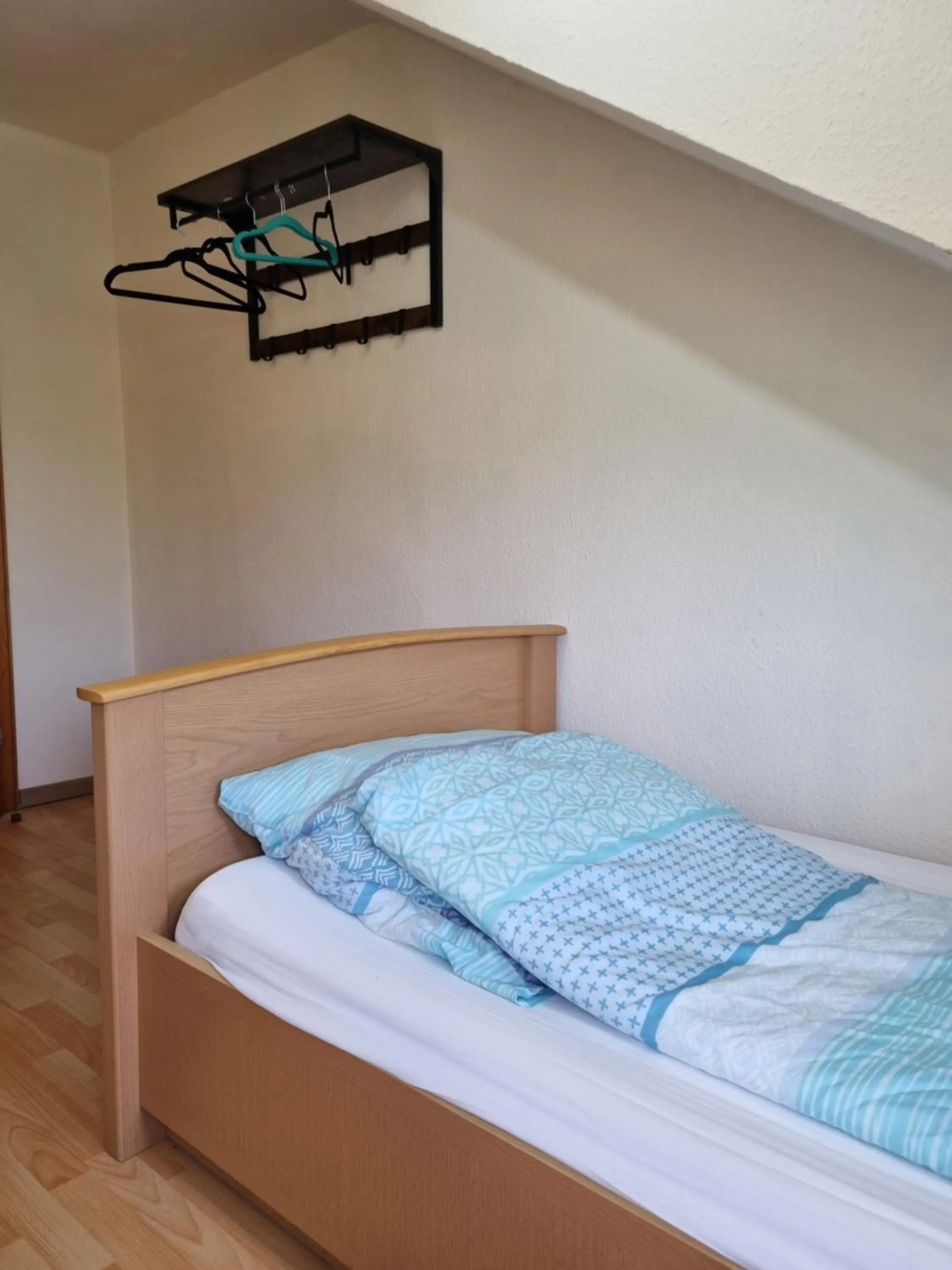 Bed in Famile Hotel Kameleon