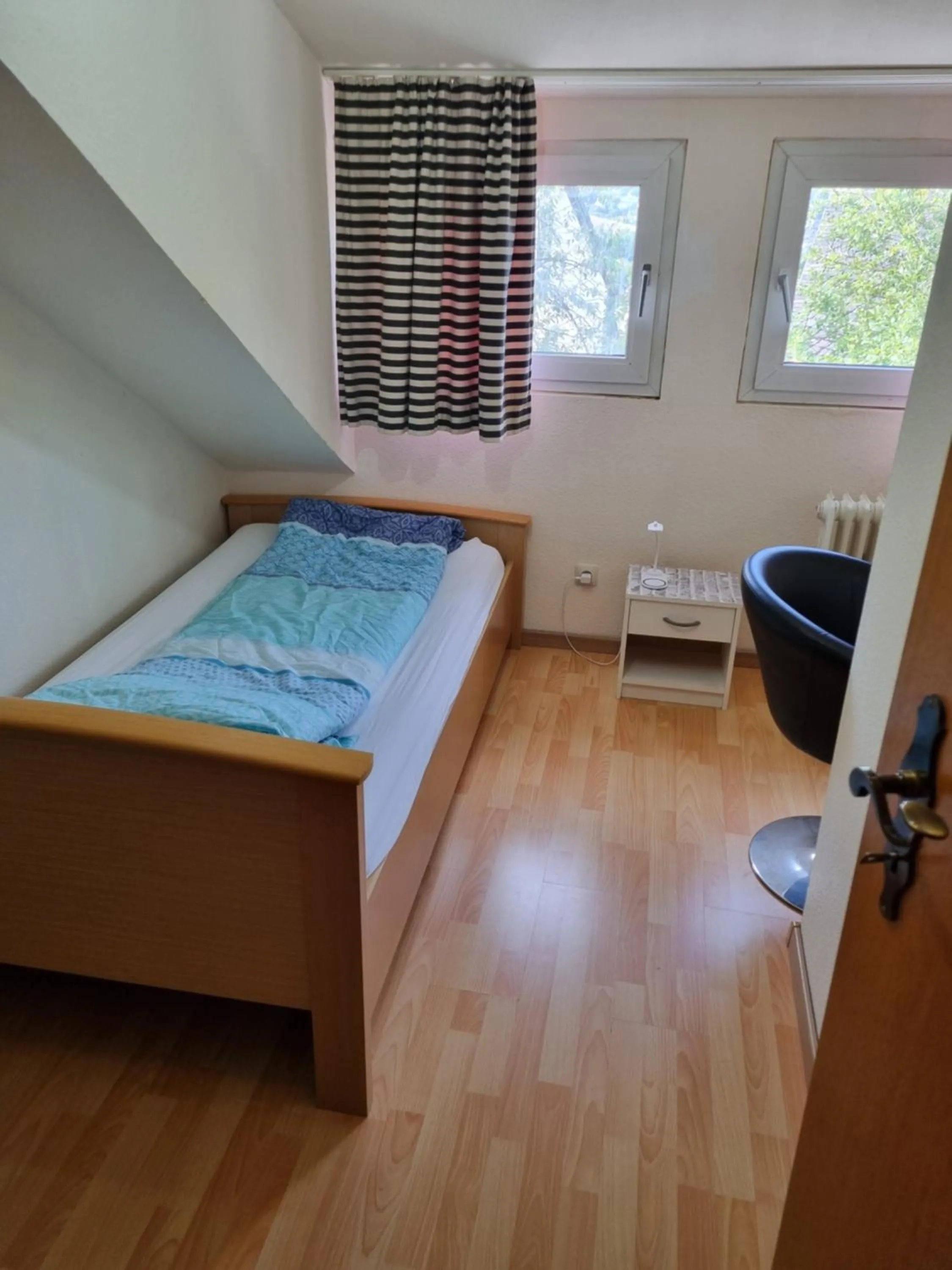 Bed in Famile Hotel Kameleon