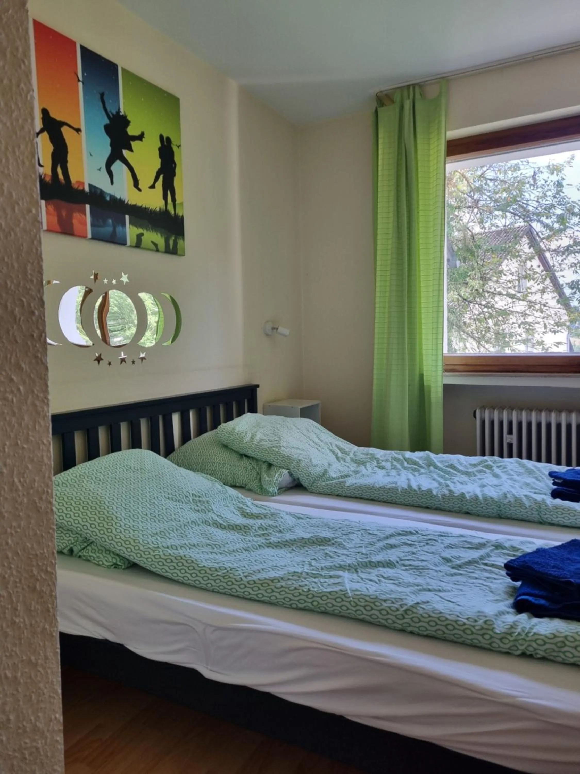 Bed in Famile Hotel Kameleon
