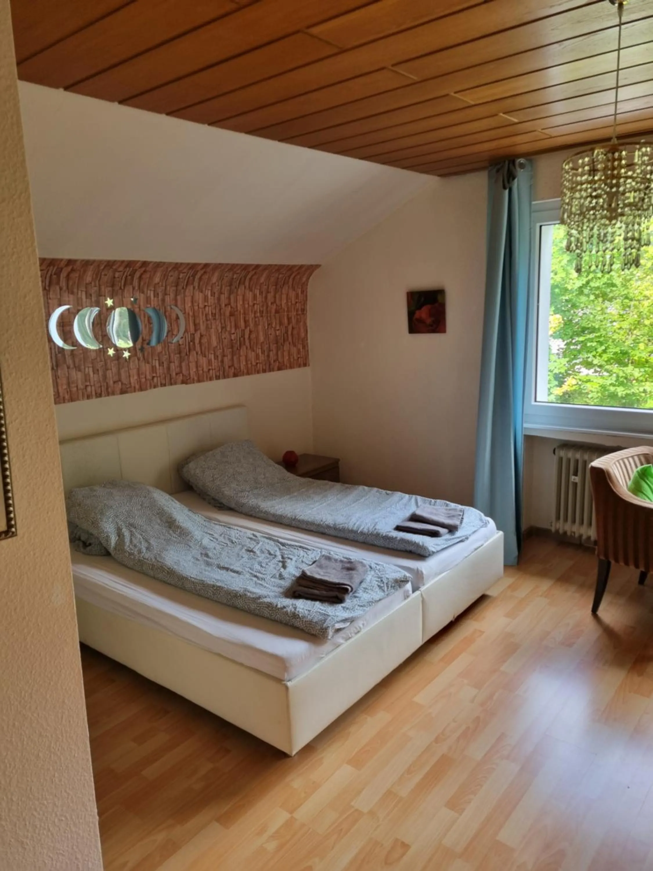 Bed in Famile Hotel Kameleon