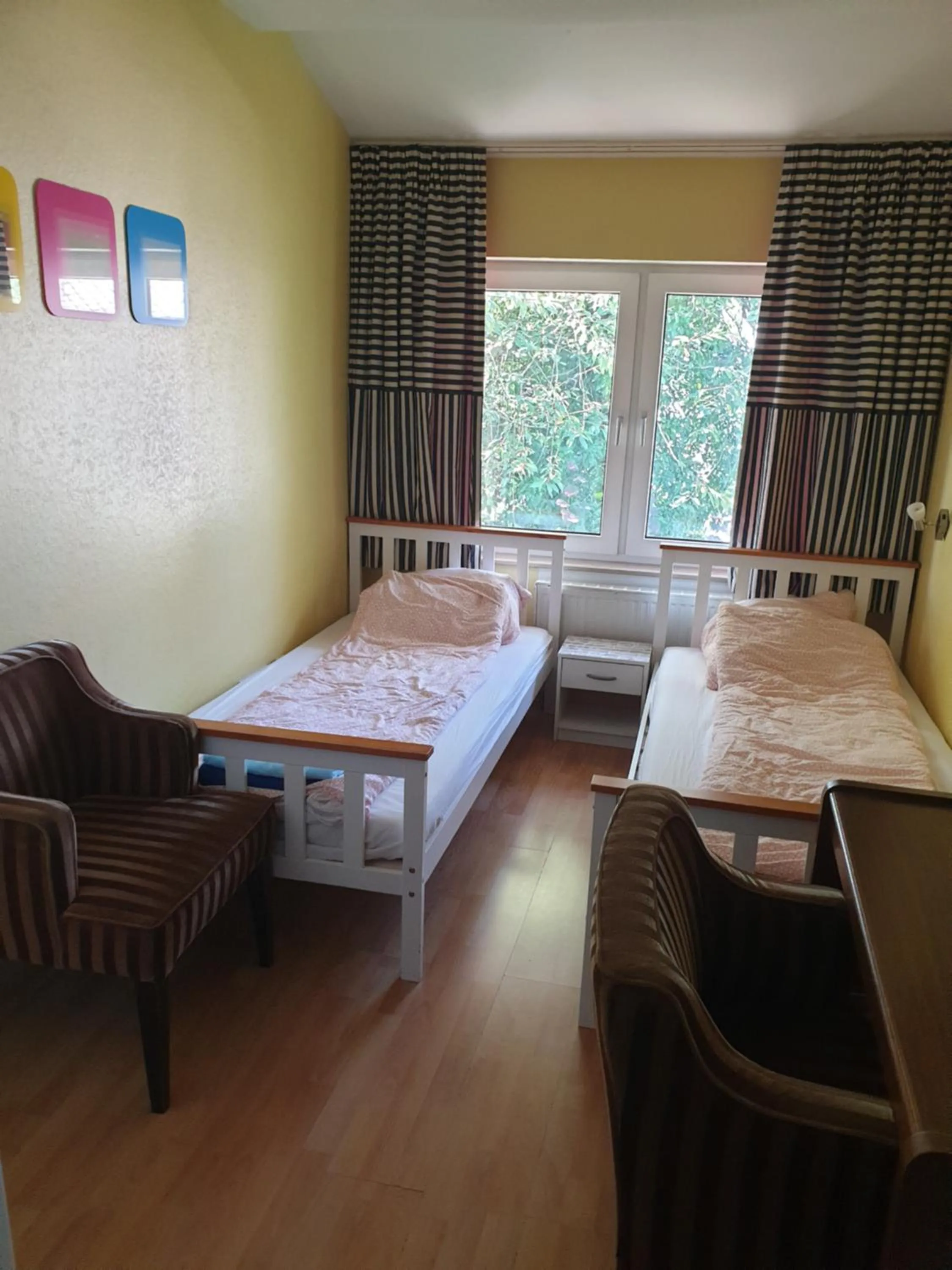 Bed in Famile Hotel Kameleon