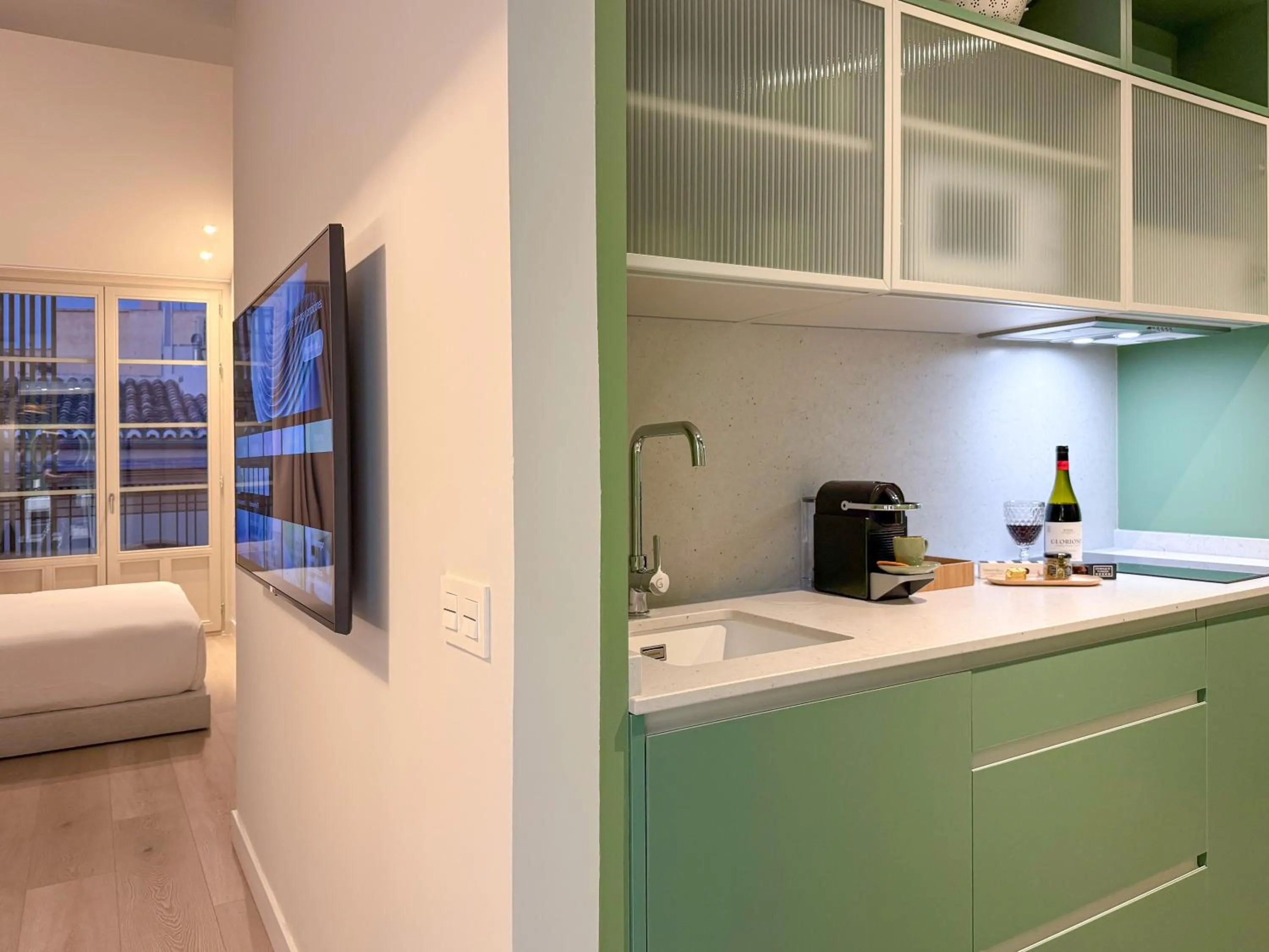 Kitchen or kitchenette, Bed in Coeo Frailes Design Apartments