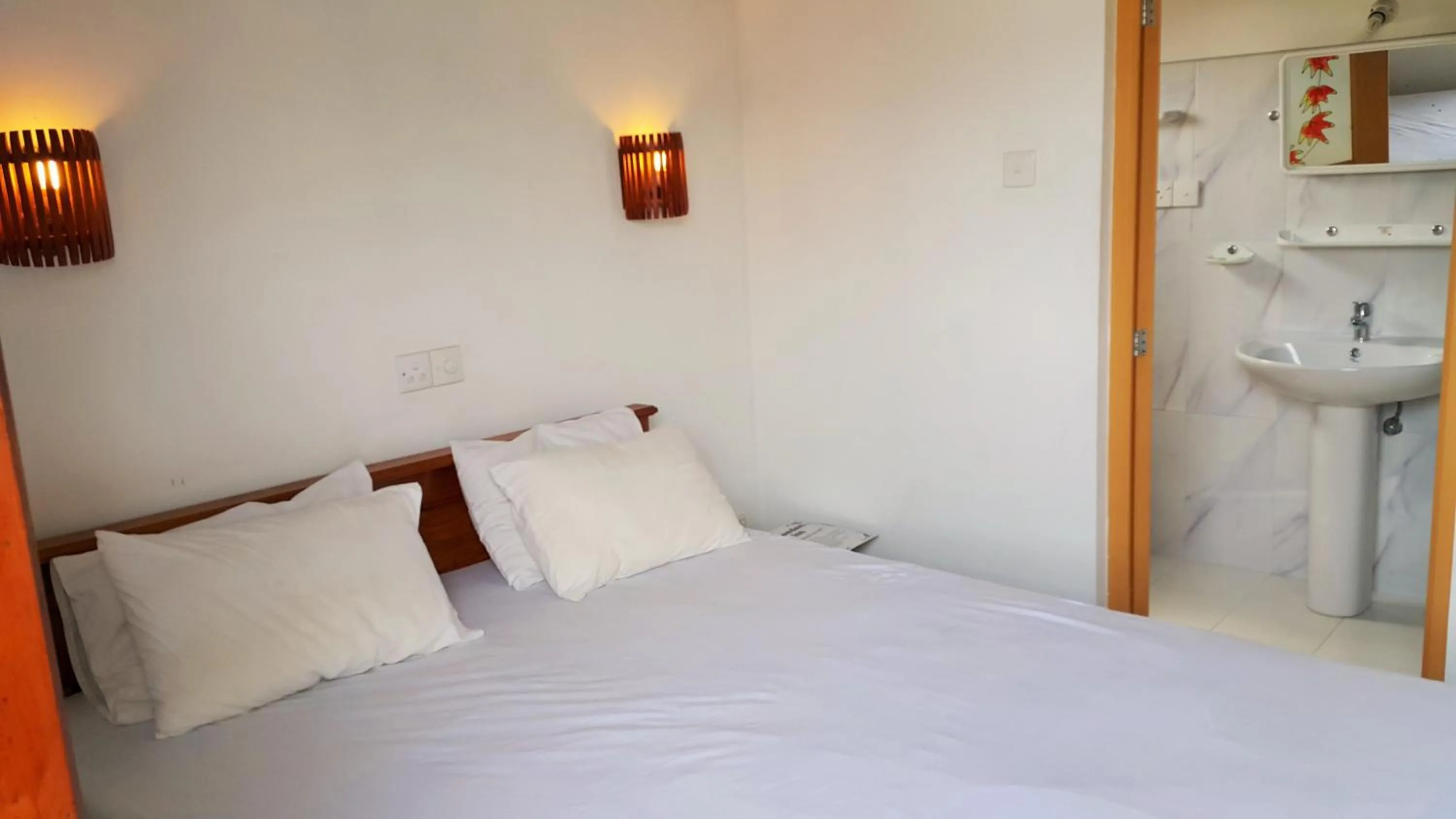 Bed in Sweden Inn Guesthouse