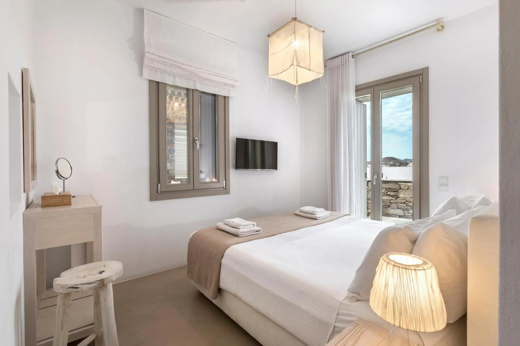 Bed in White Tinos Luxury Suites