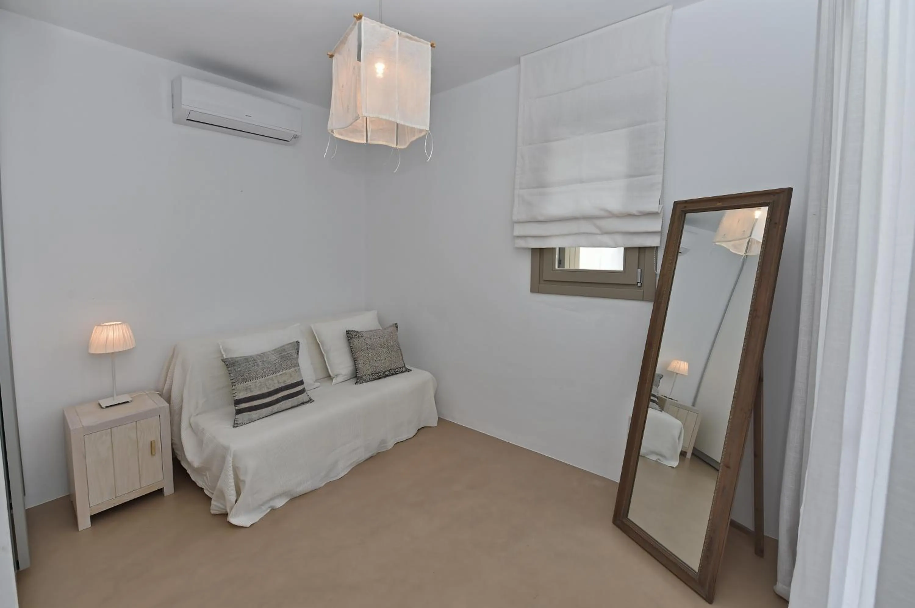 Bed in White Tinos Luxury Suites