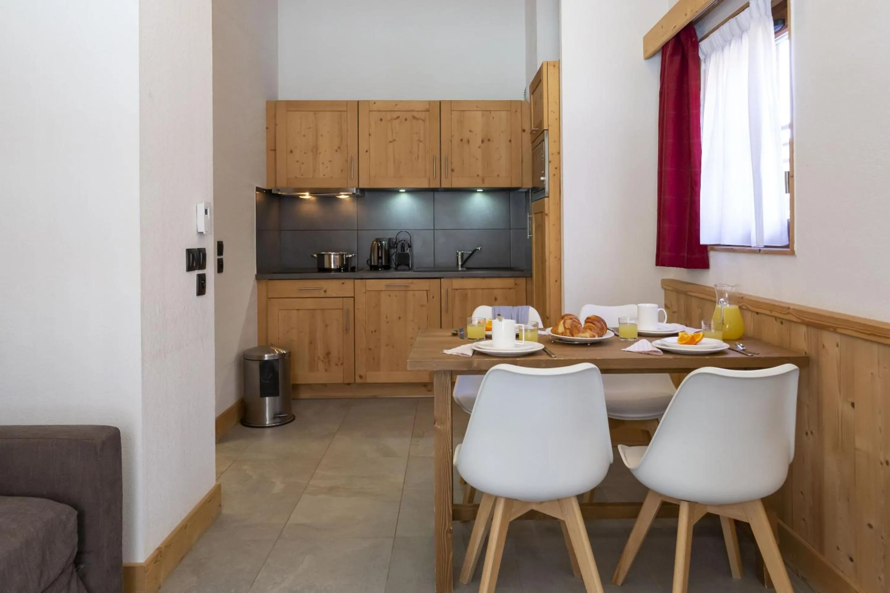 Kitchen or kitchenette in Résidence Odalys Les Fermes de Châtel