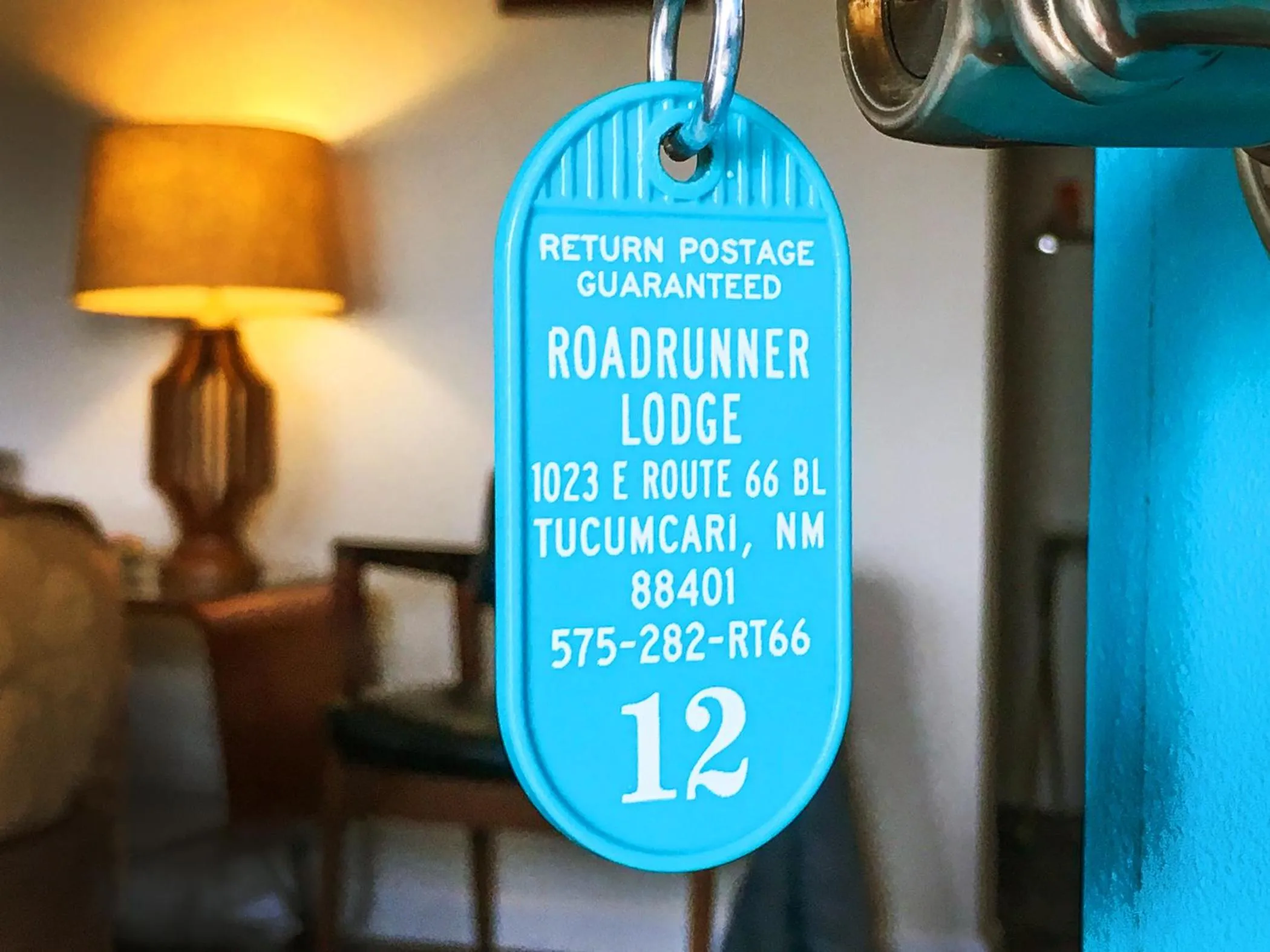 Property logo or sign in Roadrunner Lodge Motel