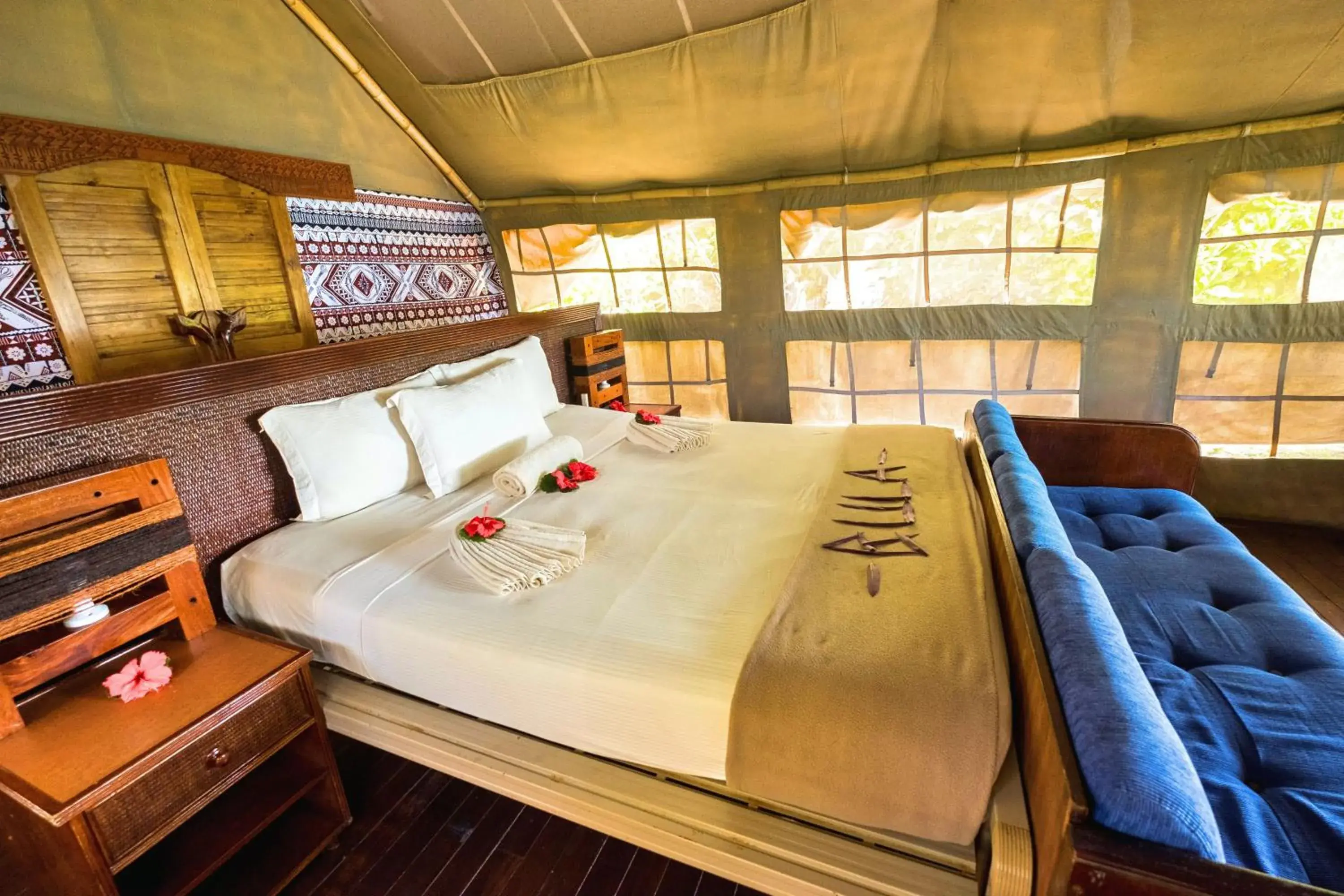 Bed in Barefoot Kuata Island Resort Bed in Barefoot Kuata Island Resort