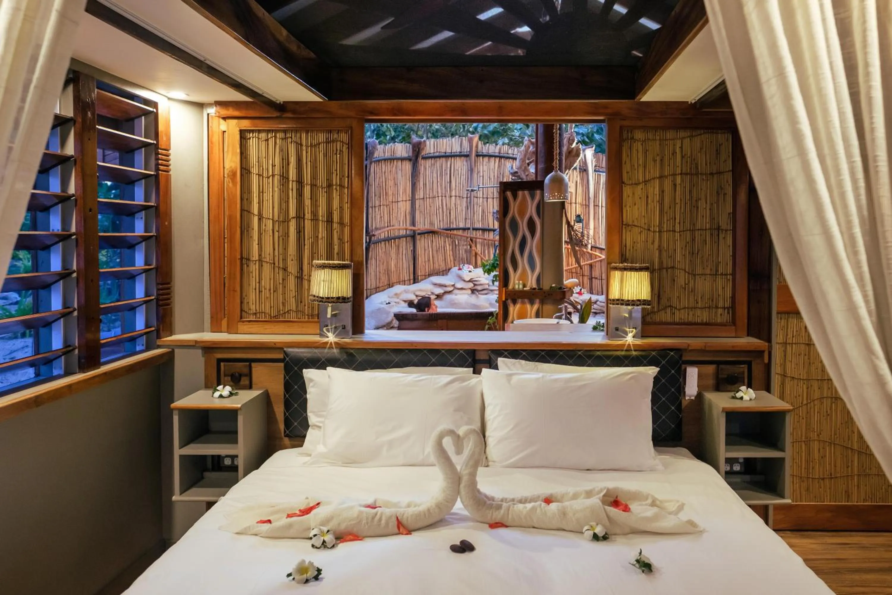 Bed in Barefoot Kuata Island Resort