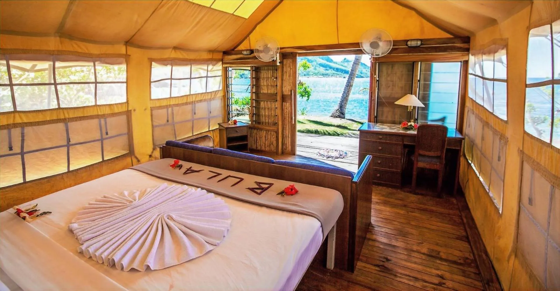 Bed in Barefoot Kuata Island Resort