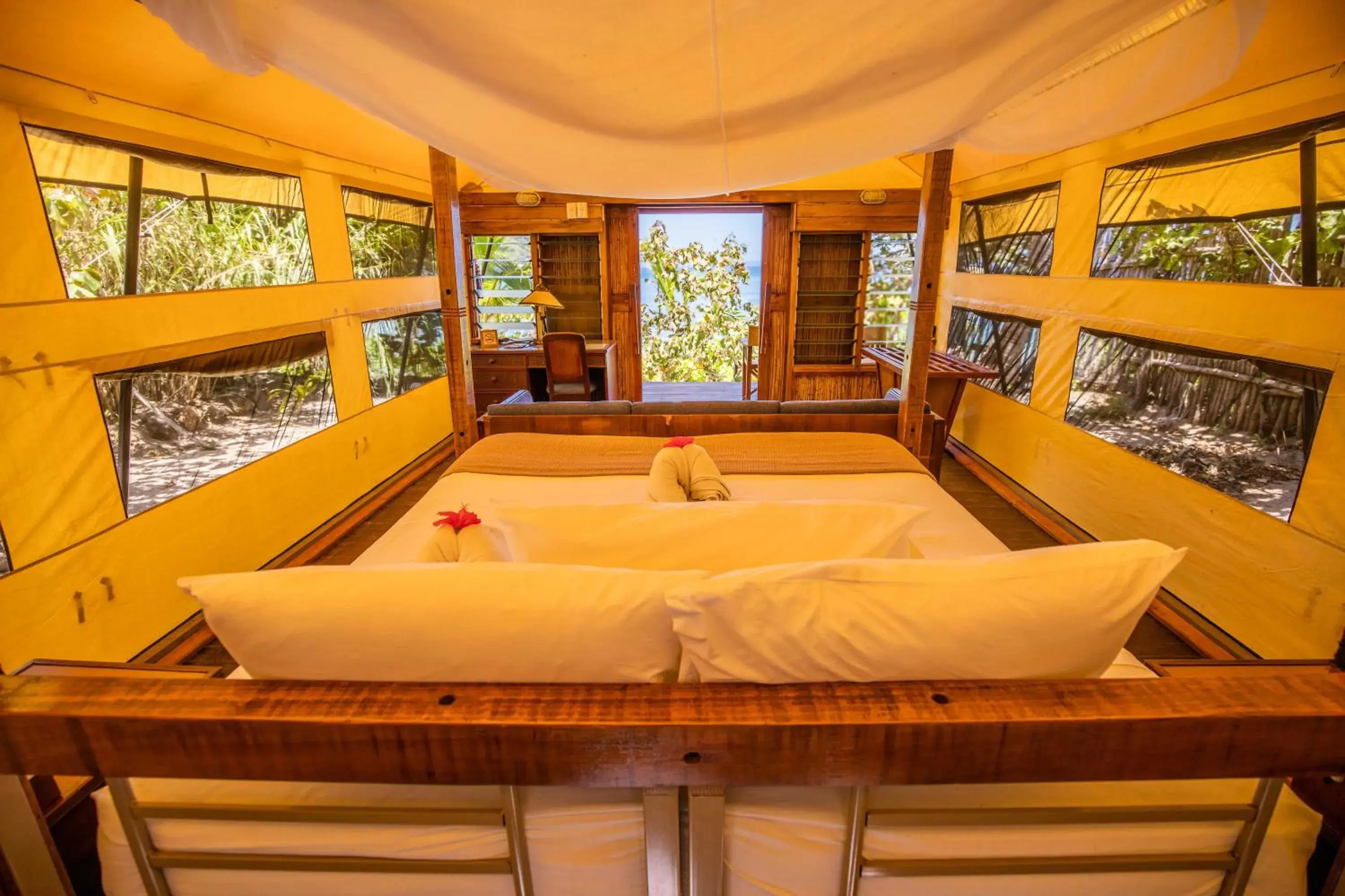 Bed in Barefoot Kuata Island Resort Bed in Barefoot Kuata Island Resort