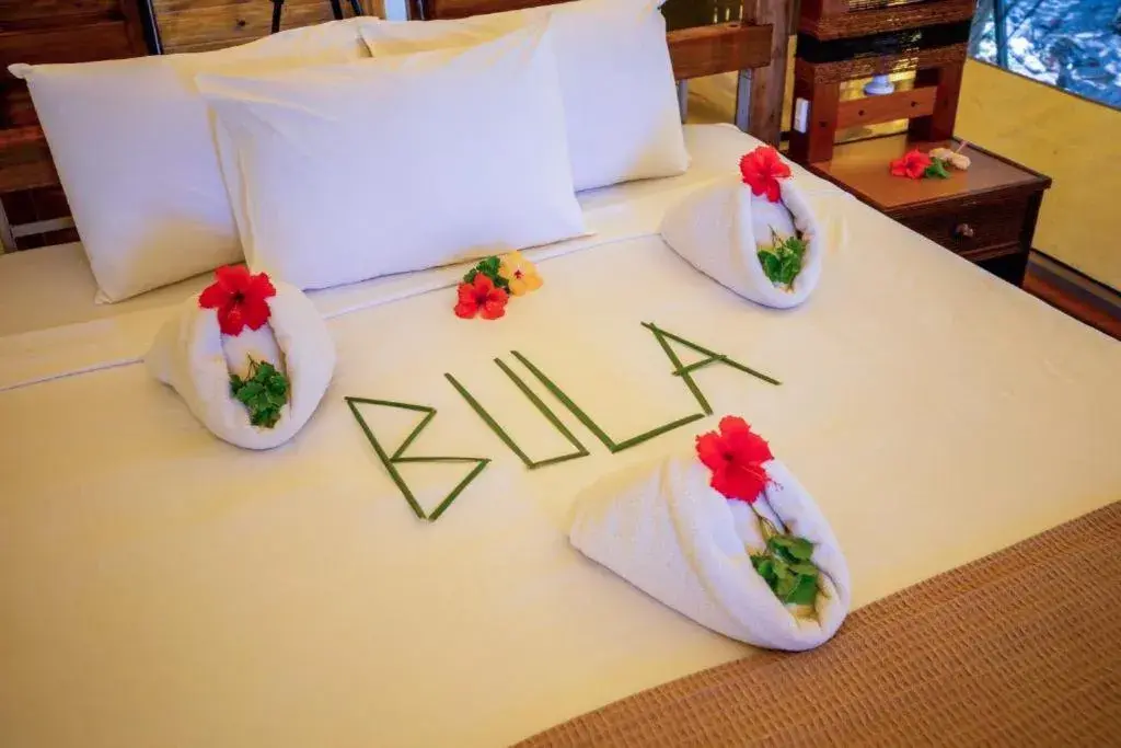 Bed in Barefoot Kuata Island Resort Bed in Barefoot Kuata Island Resort