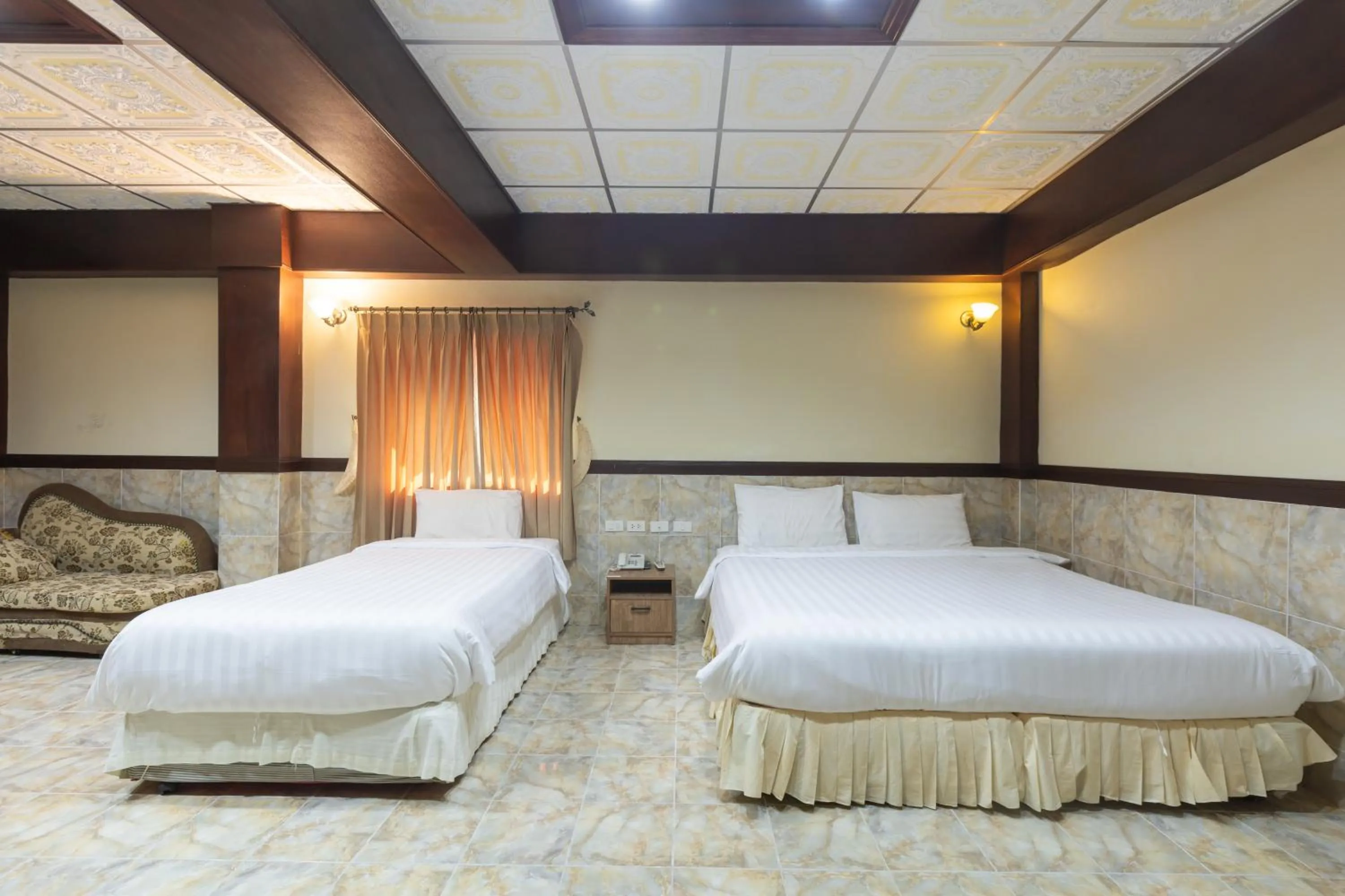 Bed in Kata Palace Phuket Hotel