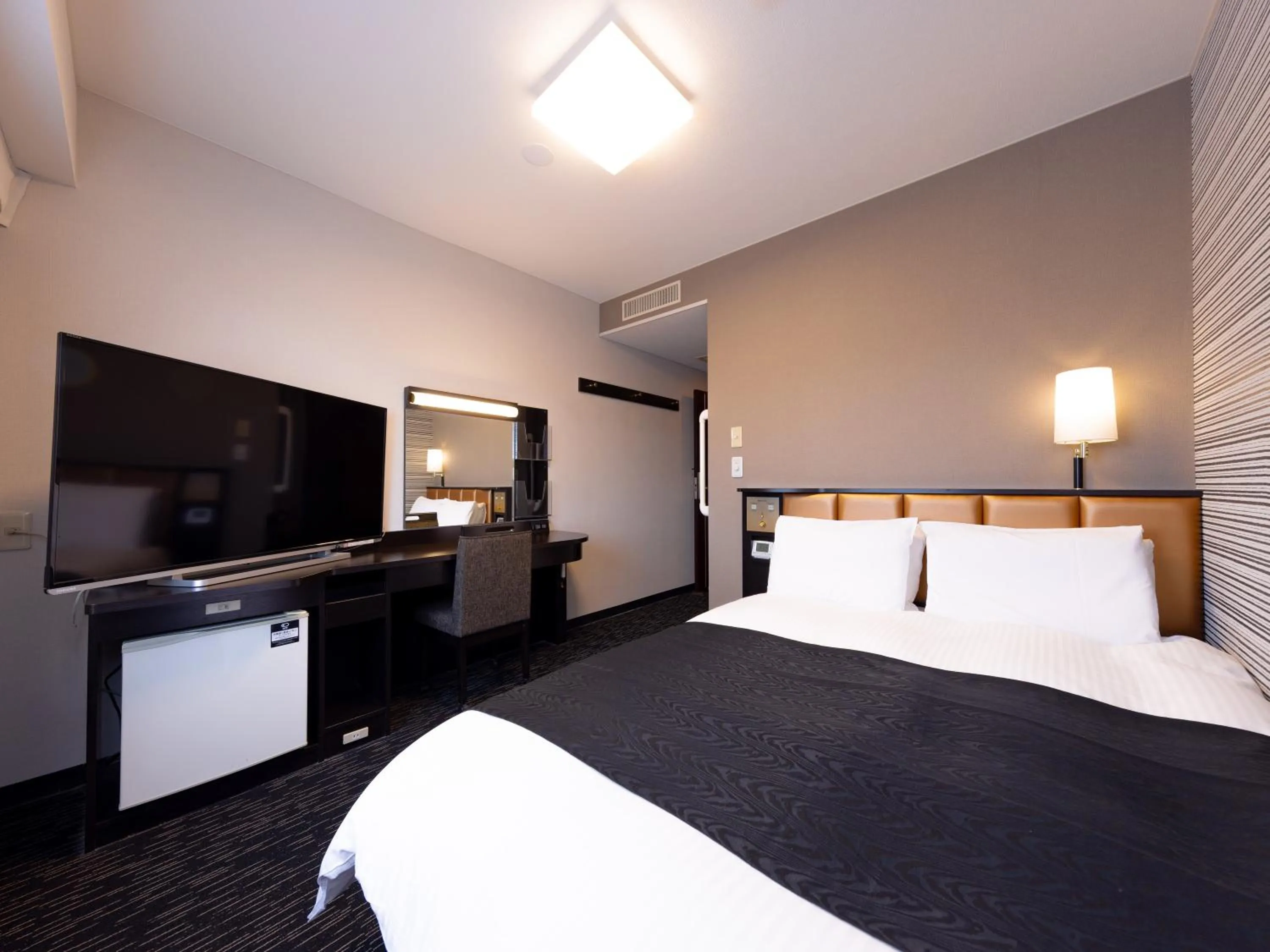 Photo of the whole room, Bed in APA Hotel Aomori Eki Kenchodori