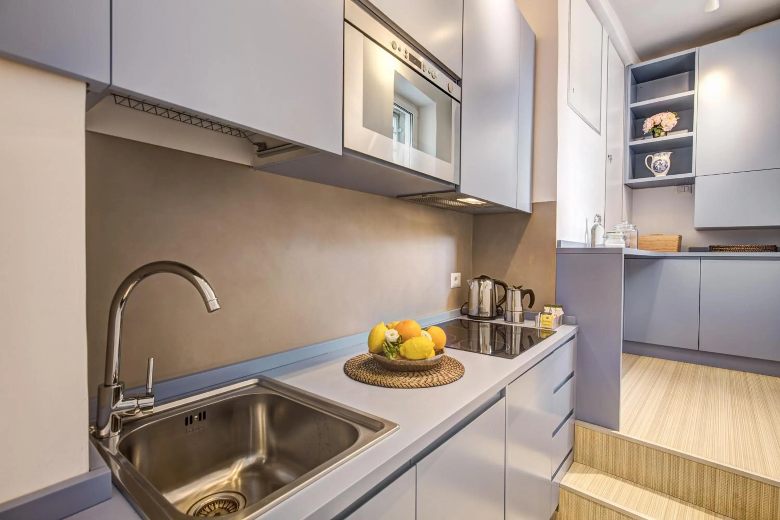 Kitchen or kitchenette in Orange Suites