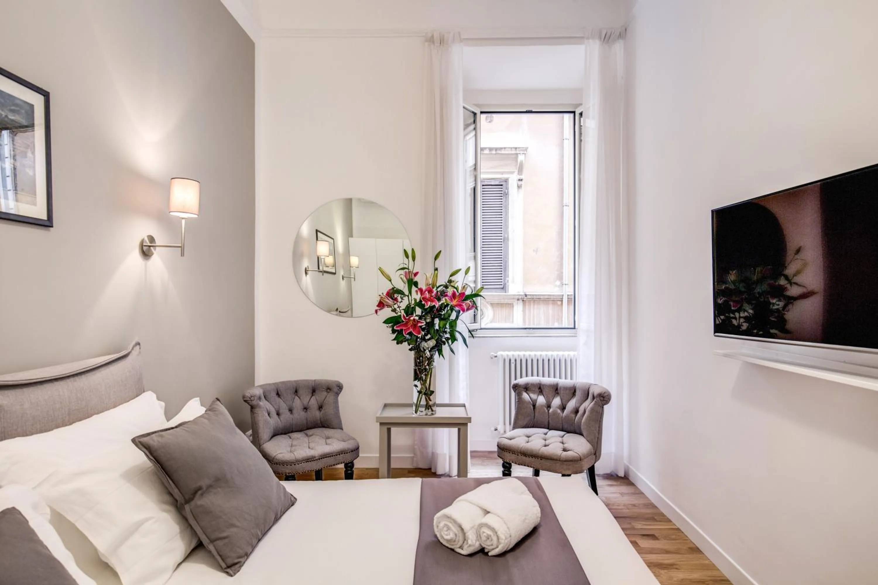 Photo of the whole room, Bed in Orange Suites