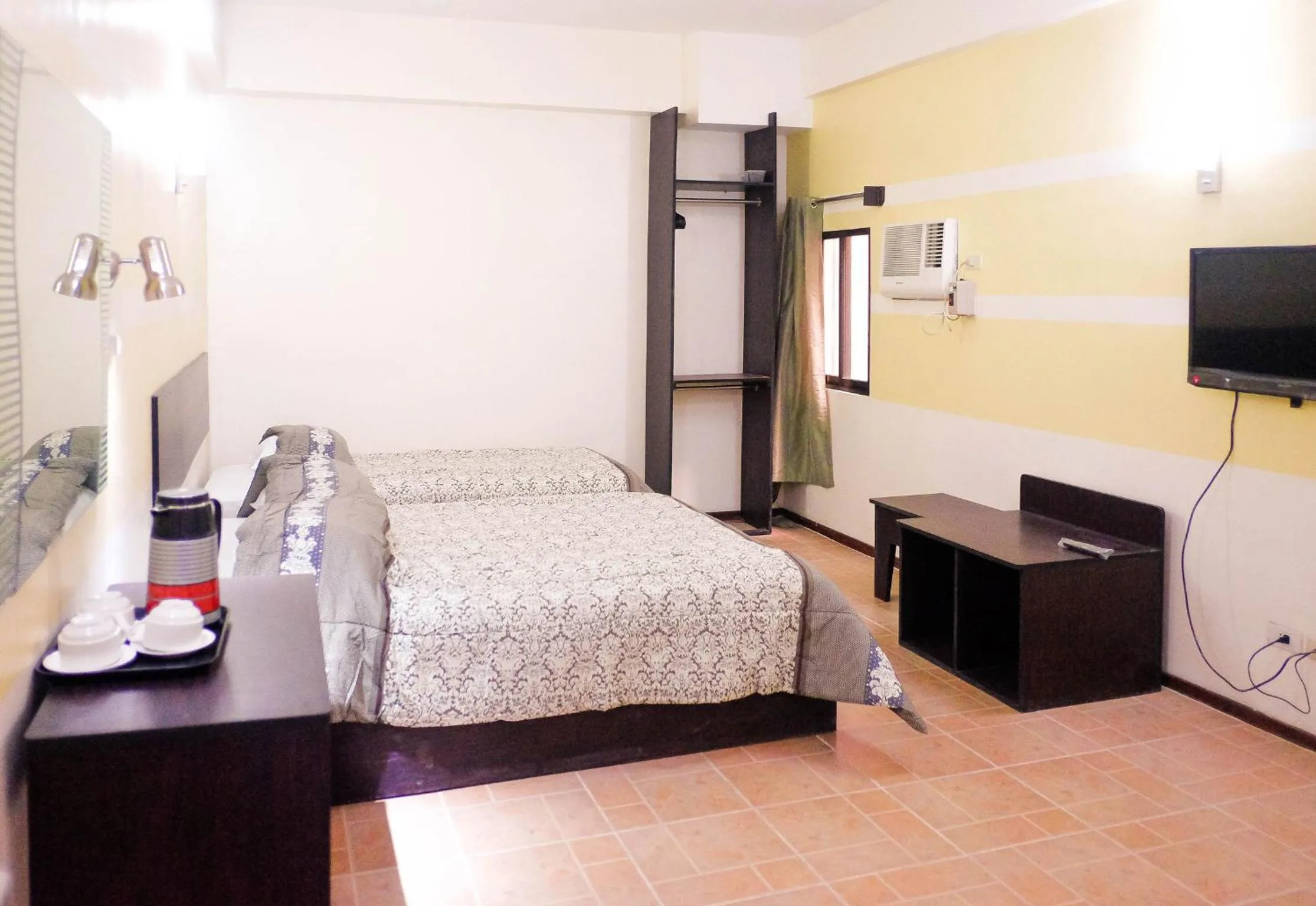 Photo of the whole room, Bed in Metro Park Hotel Mandaue