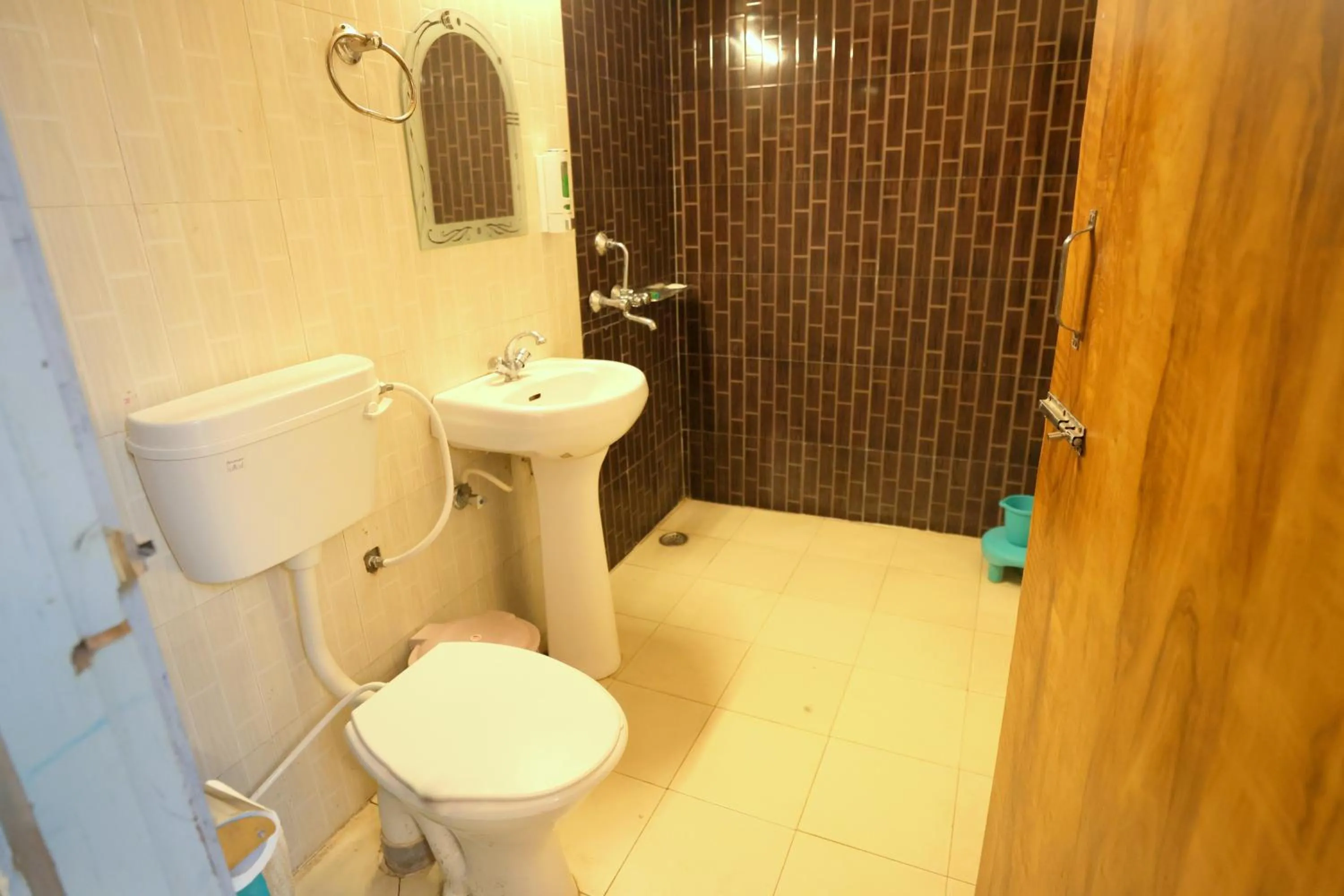Toilet in Aranya Resort & Suites By Shivaneel Hospitality