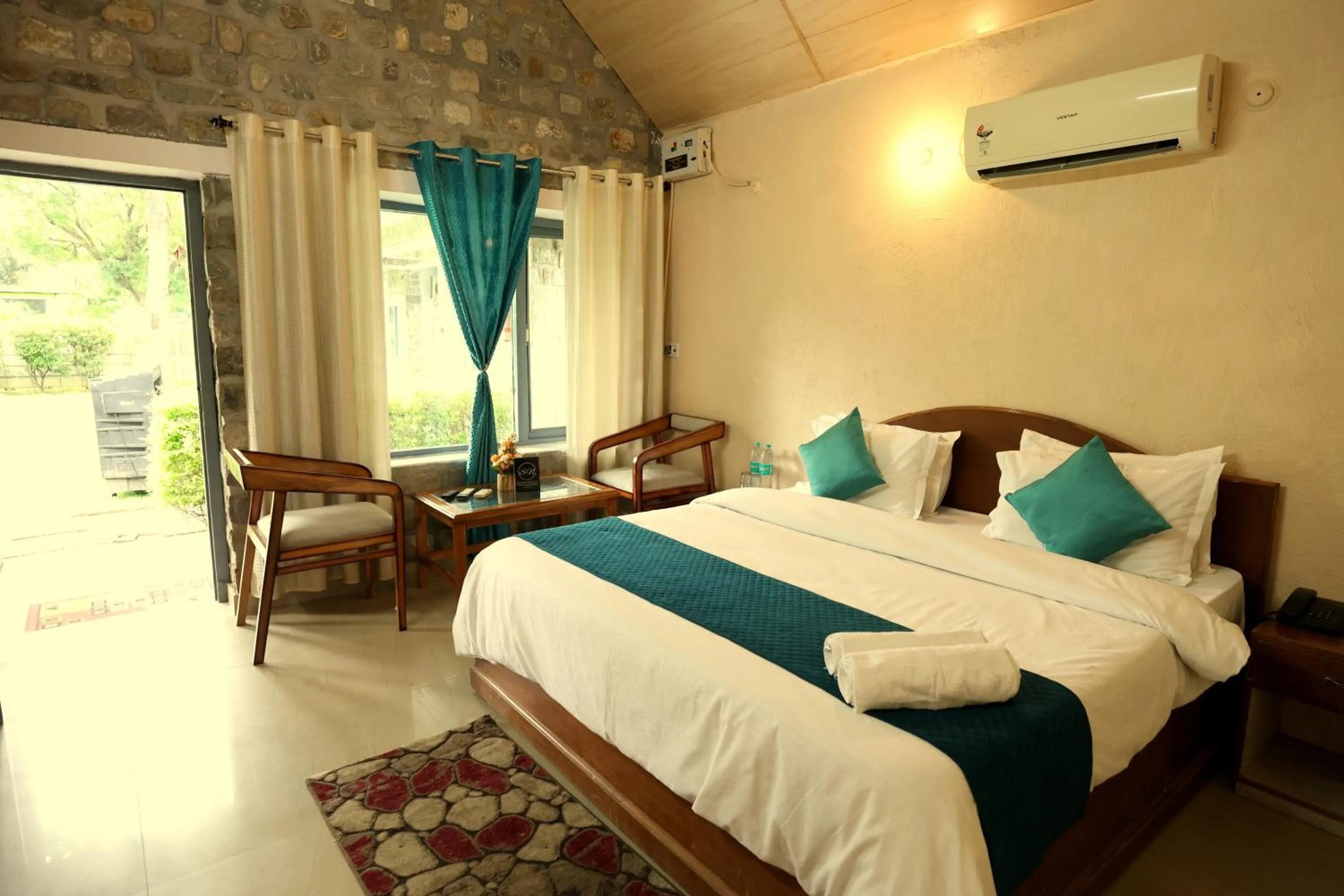 Photo of the whole room, Bed in Aranya Resort & Suites By Shivaneel Hospitality