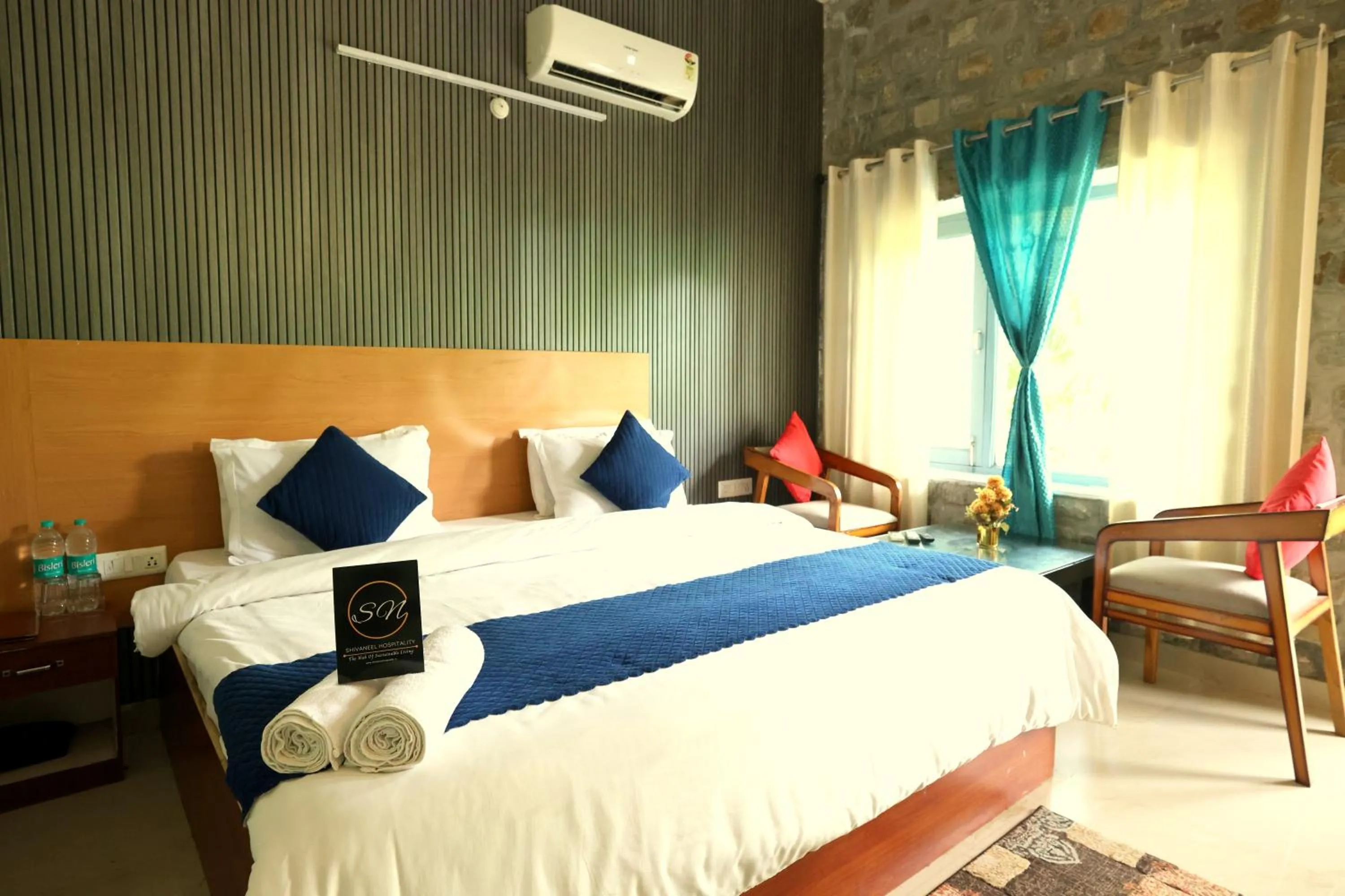 Photo of the whole room, Bed in Aranya Resort & Suites By Shivaneel Hospitality