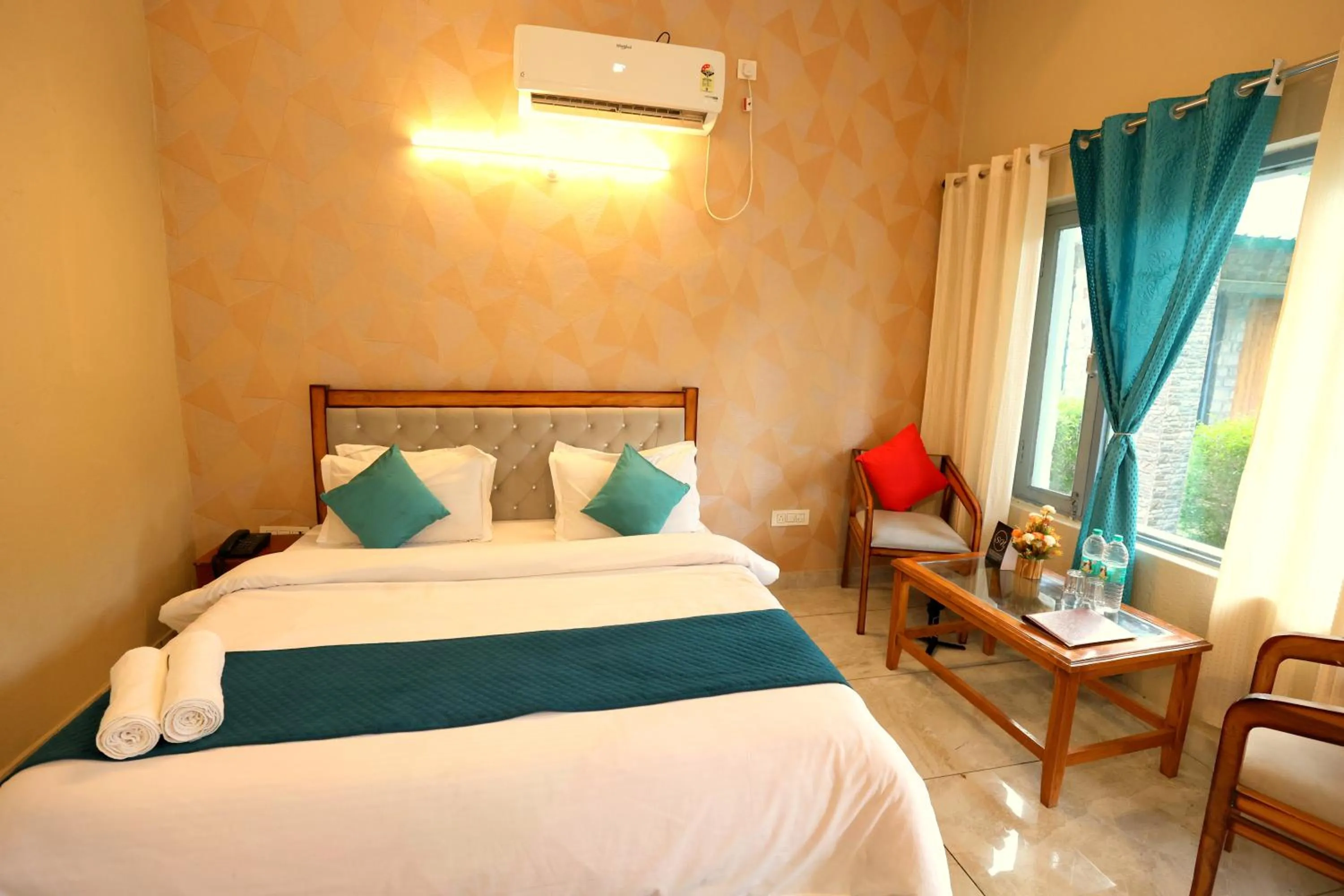 Bed in Aranya Resort & Suites By Shivaneel Hospitality