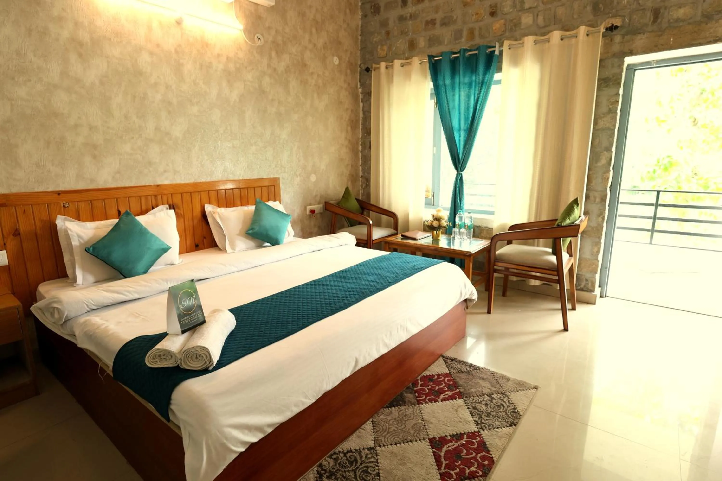 Photo of the whole room, Bed in Aranya Resort & Suites By Shivaneel Hospitality