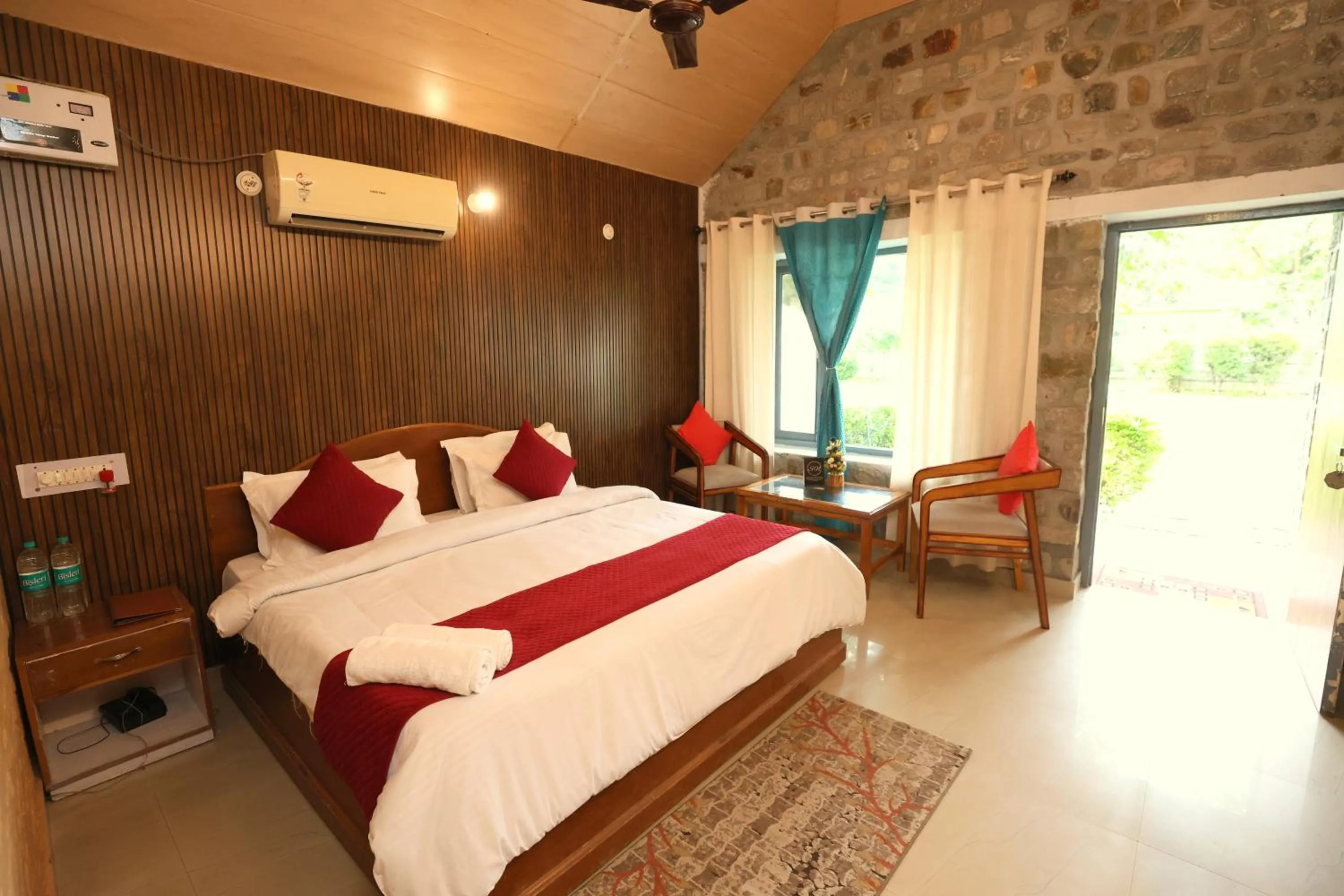 Photo of the whole room, Bed in Aranya Resort & Suites By Shivaneel Hospitality