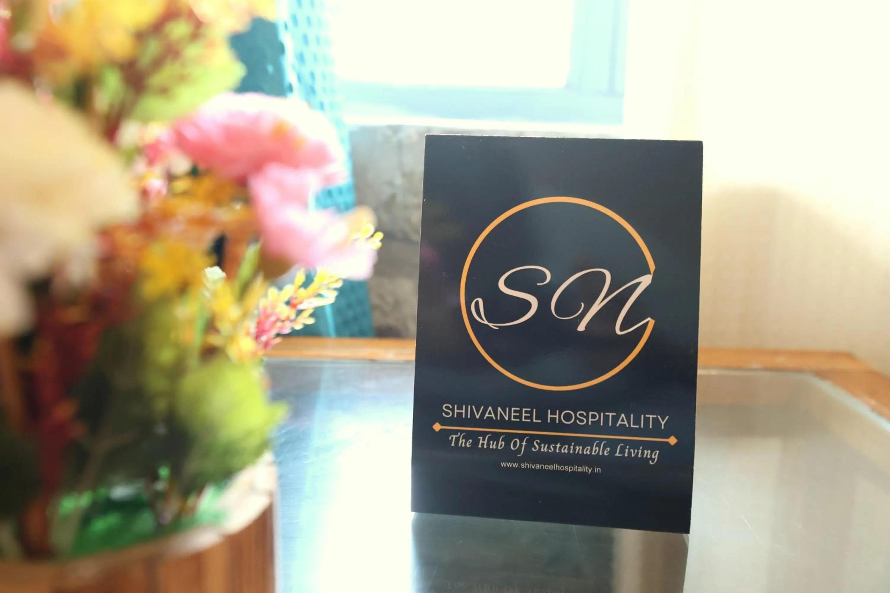 Property logo or sign in Aranya Resort & Suites By Shivaneel Hospitality