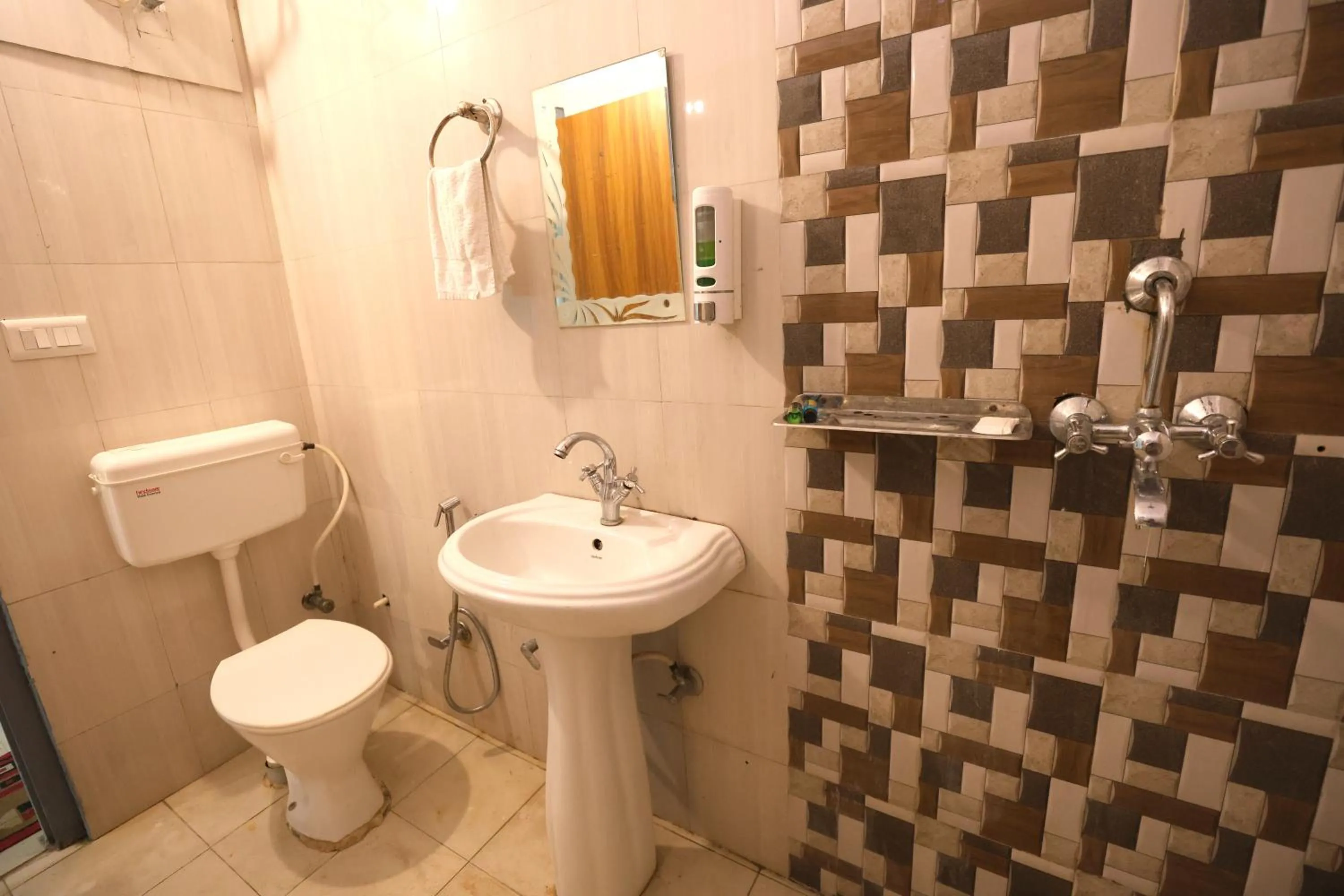 Toilet in Aranya Resort & Suites By Shivaneel Hospitality