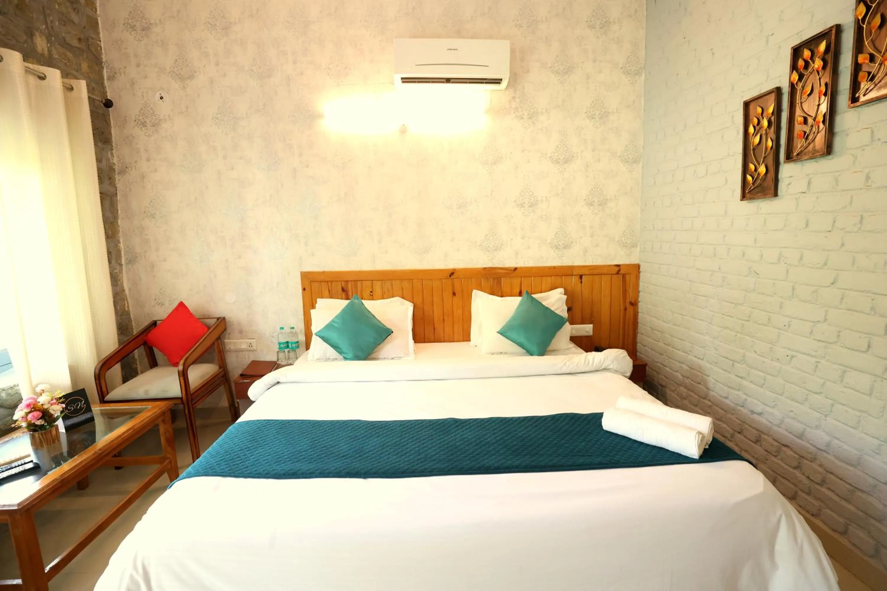Photo of the whole room, Bed in Aranya Resort & Suites By Shivaneel Hospitality
