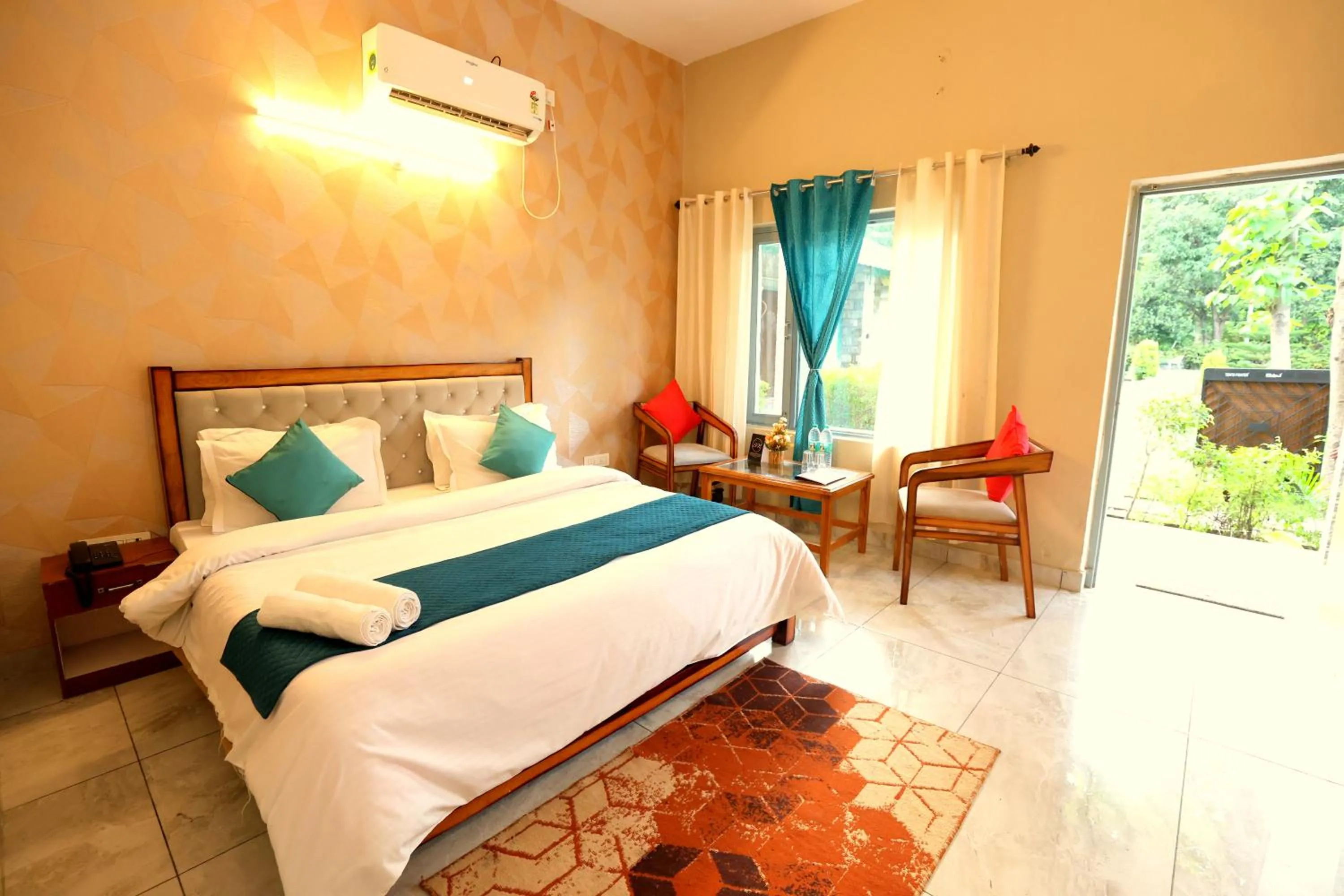 Bed in Aranya Resort & Suites By Shivaneel Hospitality