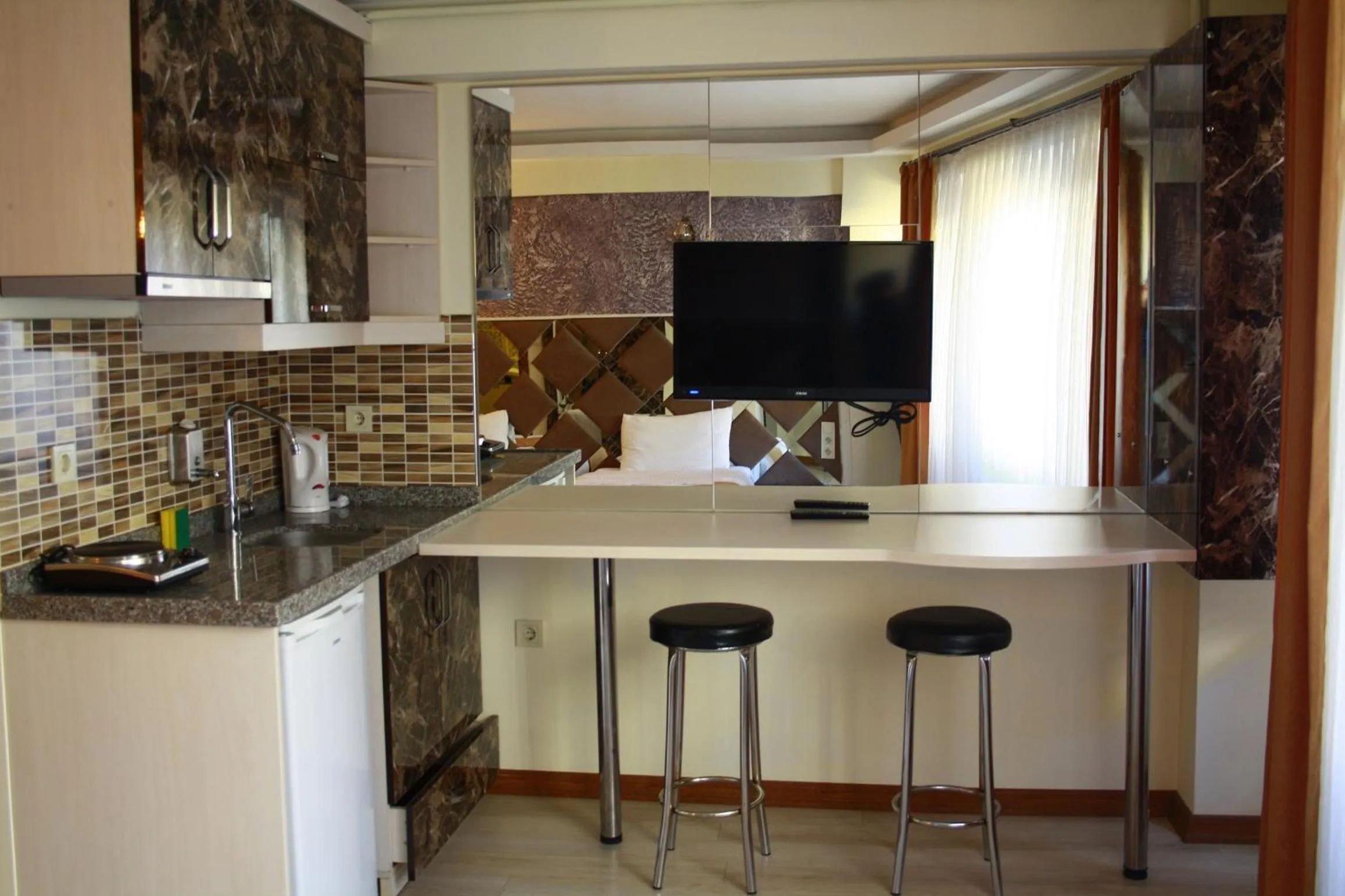 Kitchen or kitchenette in Terra Suites
