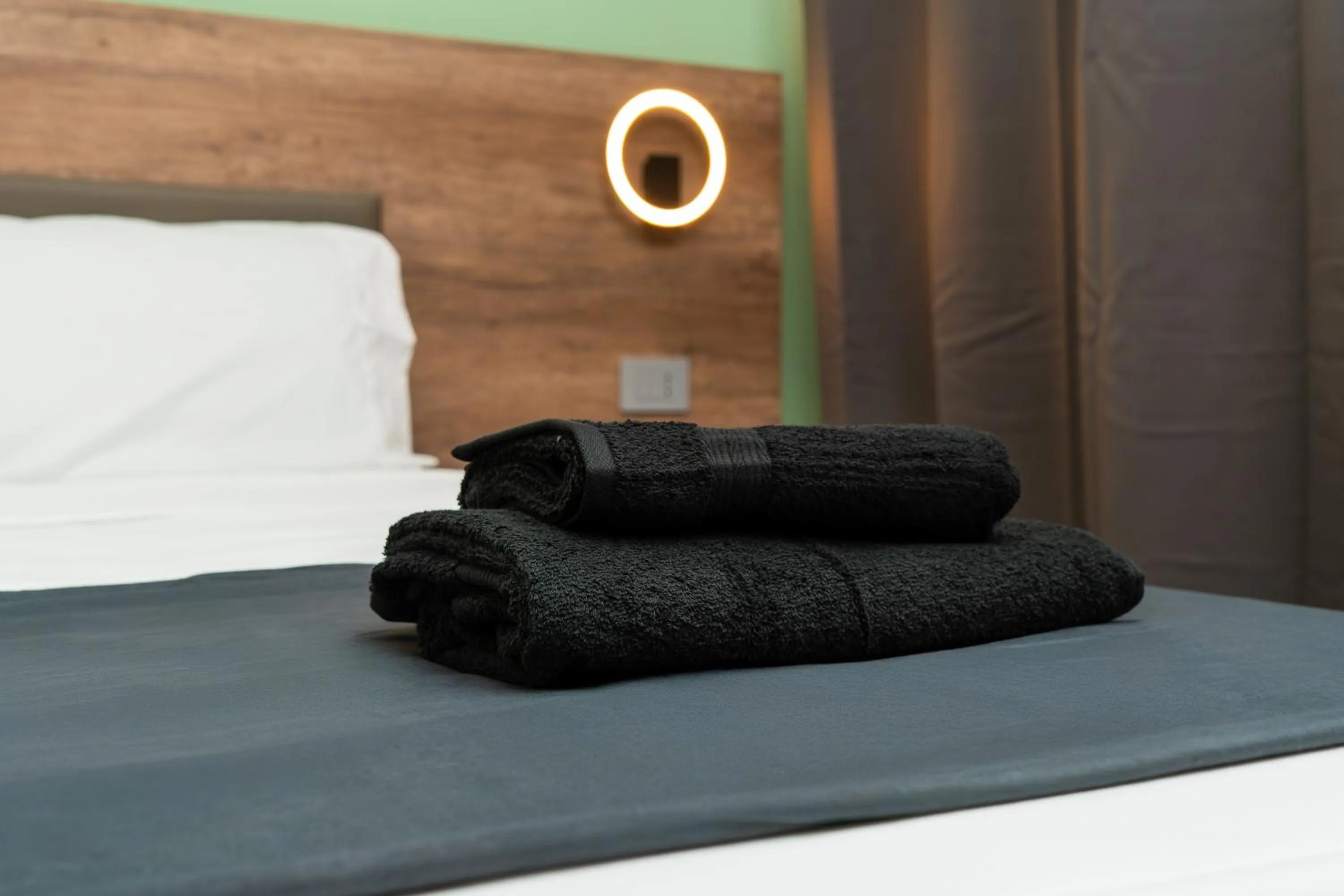 Bed in Elysium Self Check-In Rooms