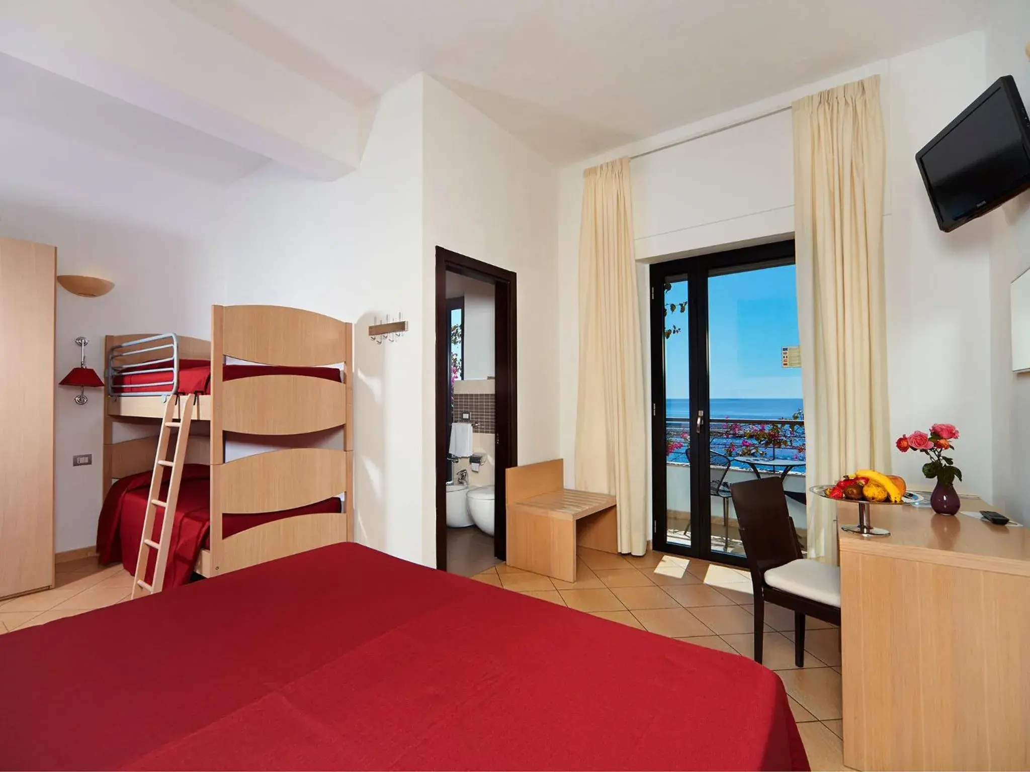 Quadruple Room with Balcony and Sea View in Hotel Cala Luna Quadruple Room with Balcony and Sea View in Hotel Cala Luna