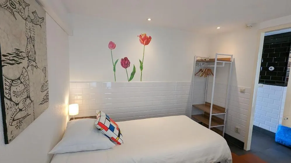 Bed in The Amsterdam Hotel Apartment in the Center